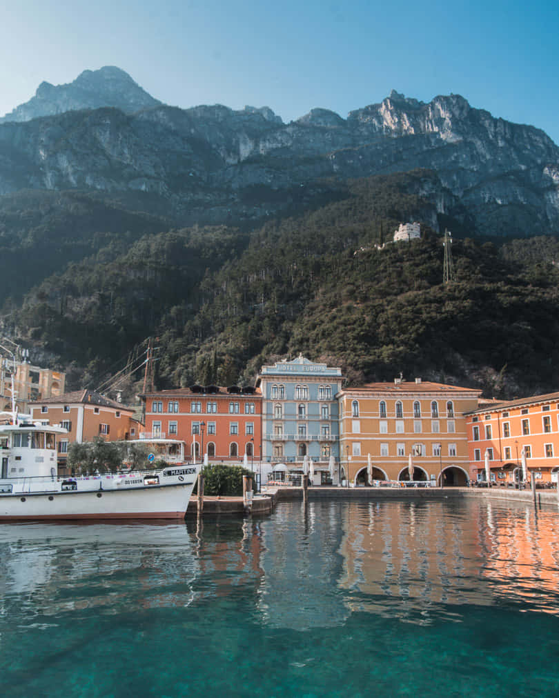 Lago Di Garda, turquoise harbor, white boat, SD Phone Wallpaper