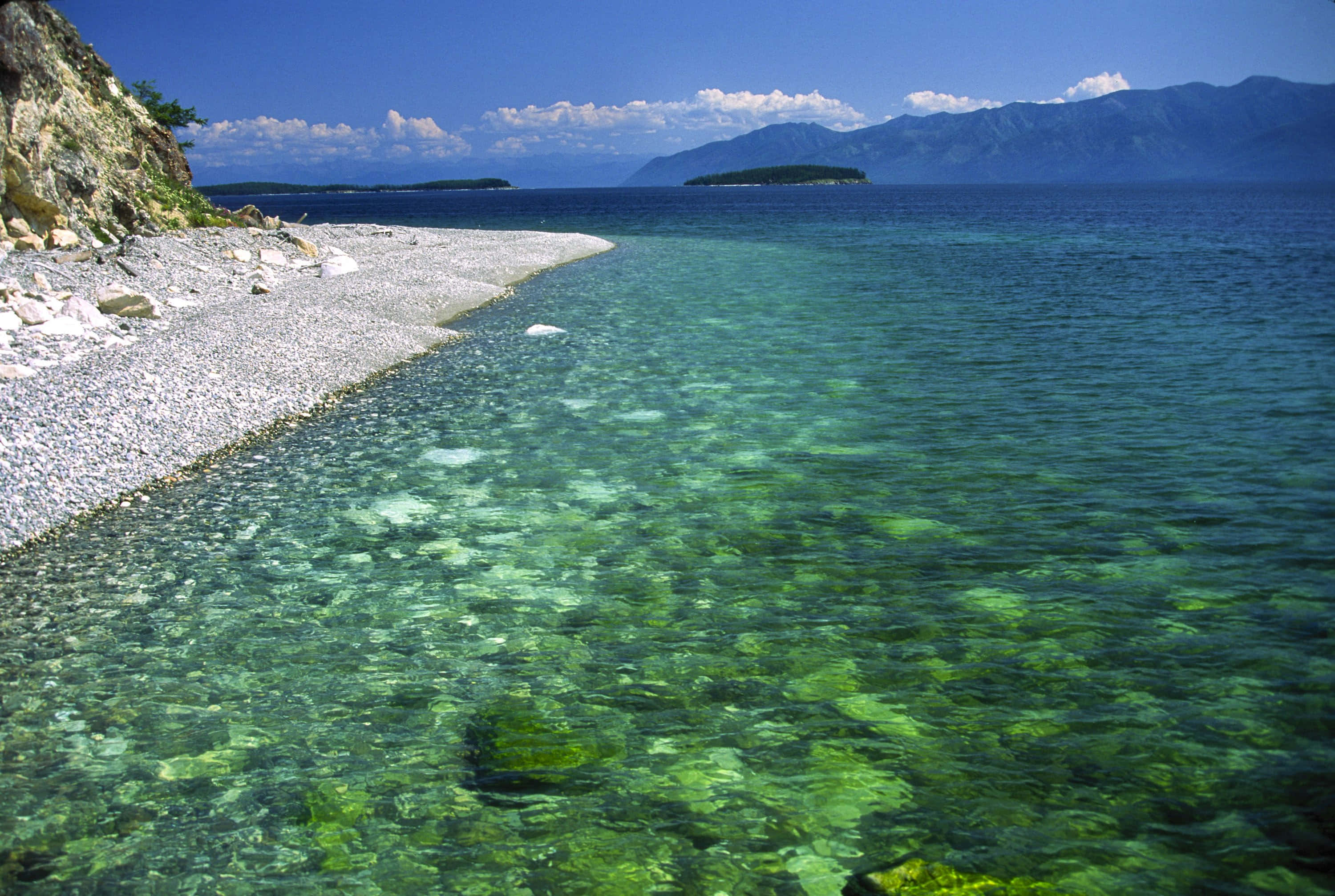 Lake Baikal, turquoise water, pebbled shore, 2K Desktop Wallpaper