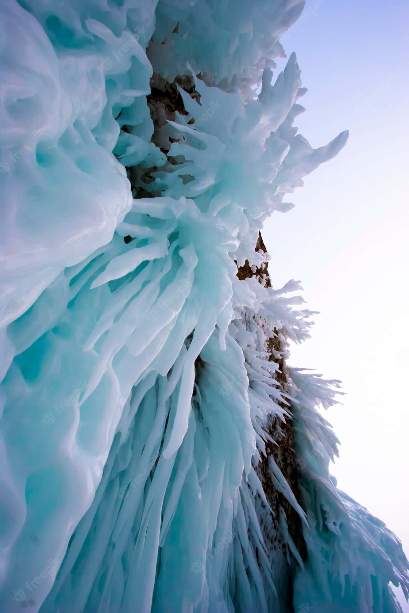 Lake Baikal, turquoise ice formations, dark rock face, Full HD Phone Wallpaper