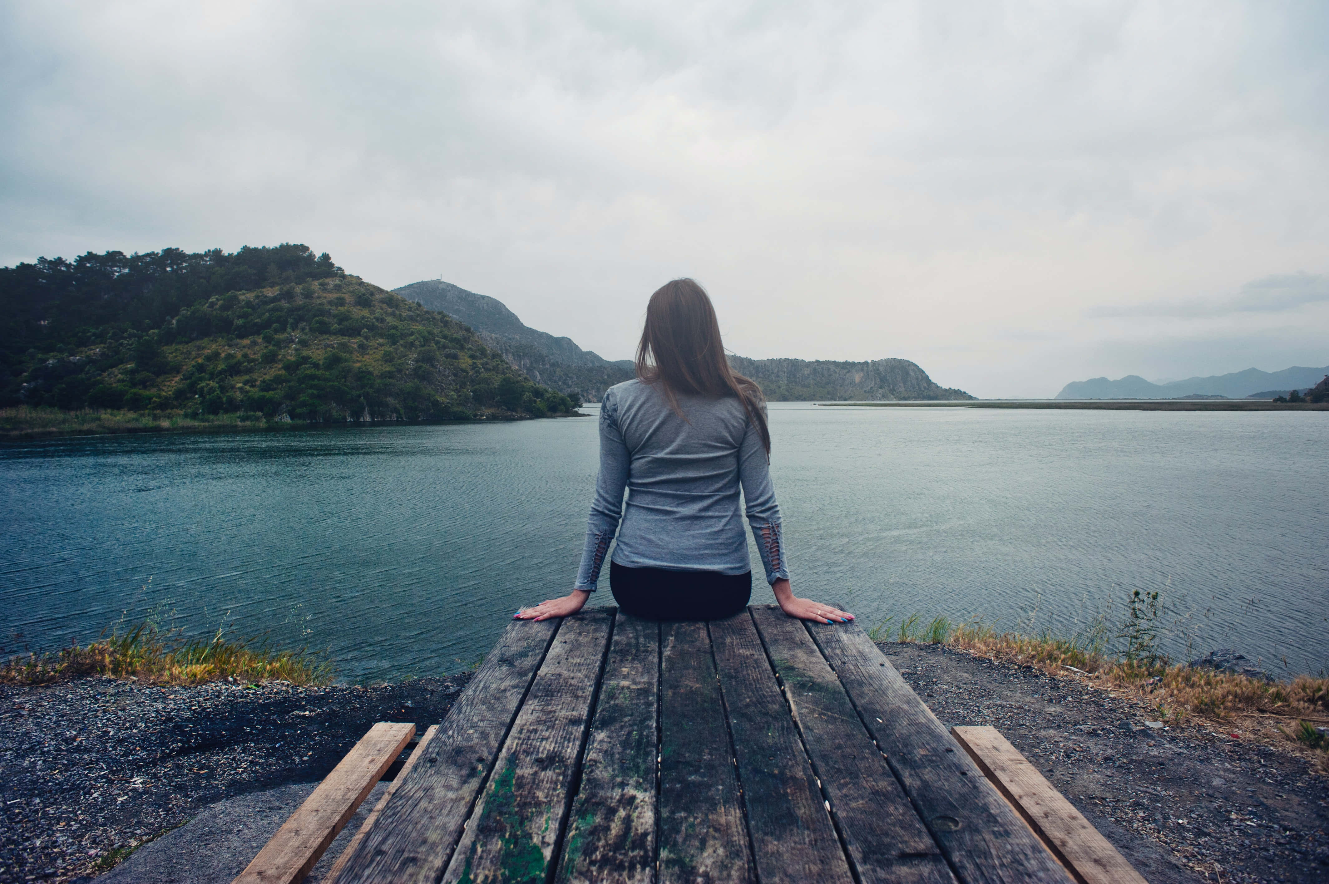 wooden dock, calm blue lake, green hills, 4K Desktop Wallpaper