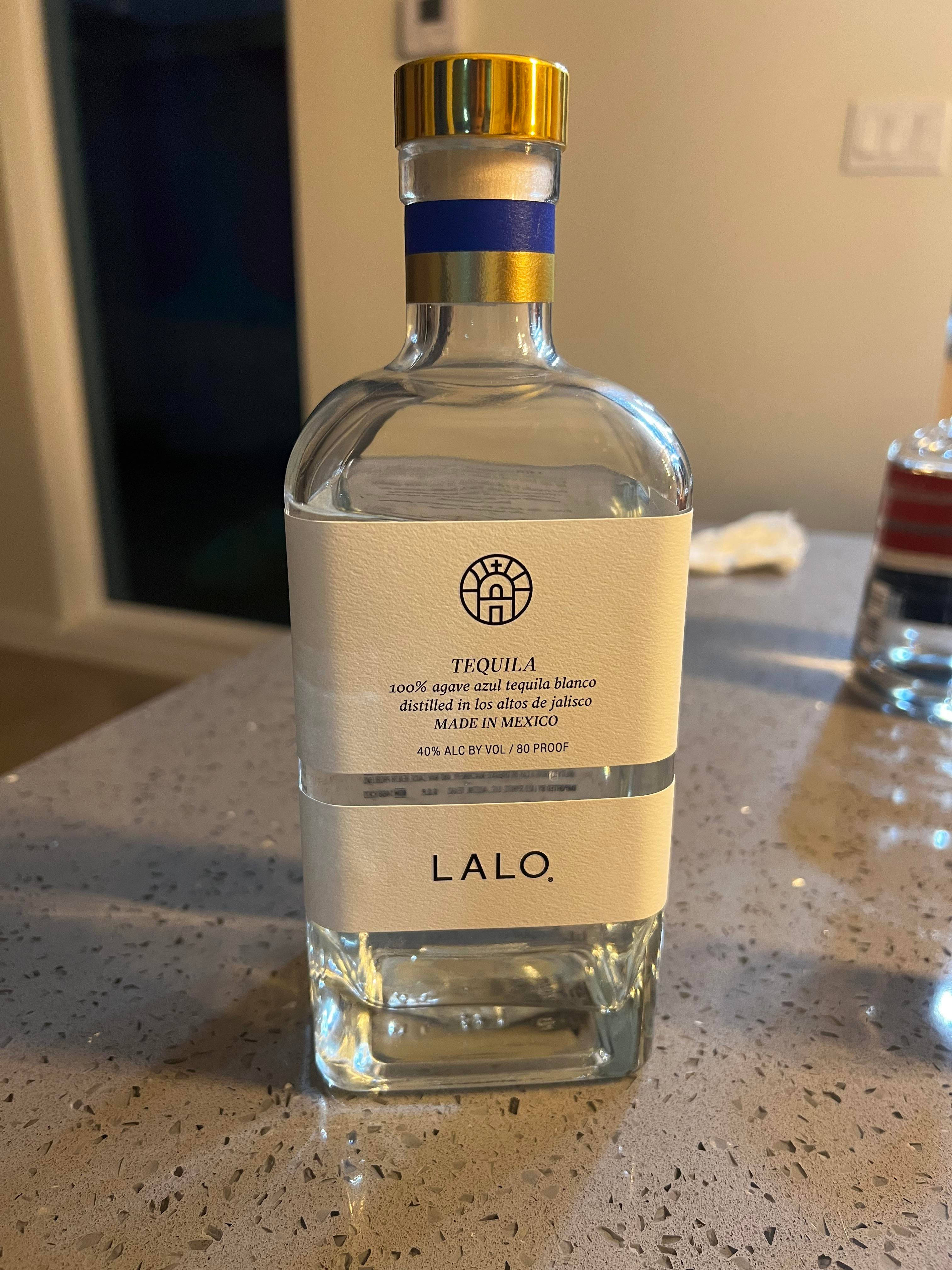 Lalo Tequila, clear bottle, gold cap, 4K Phone Wallpaper