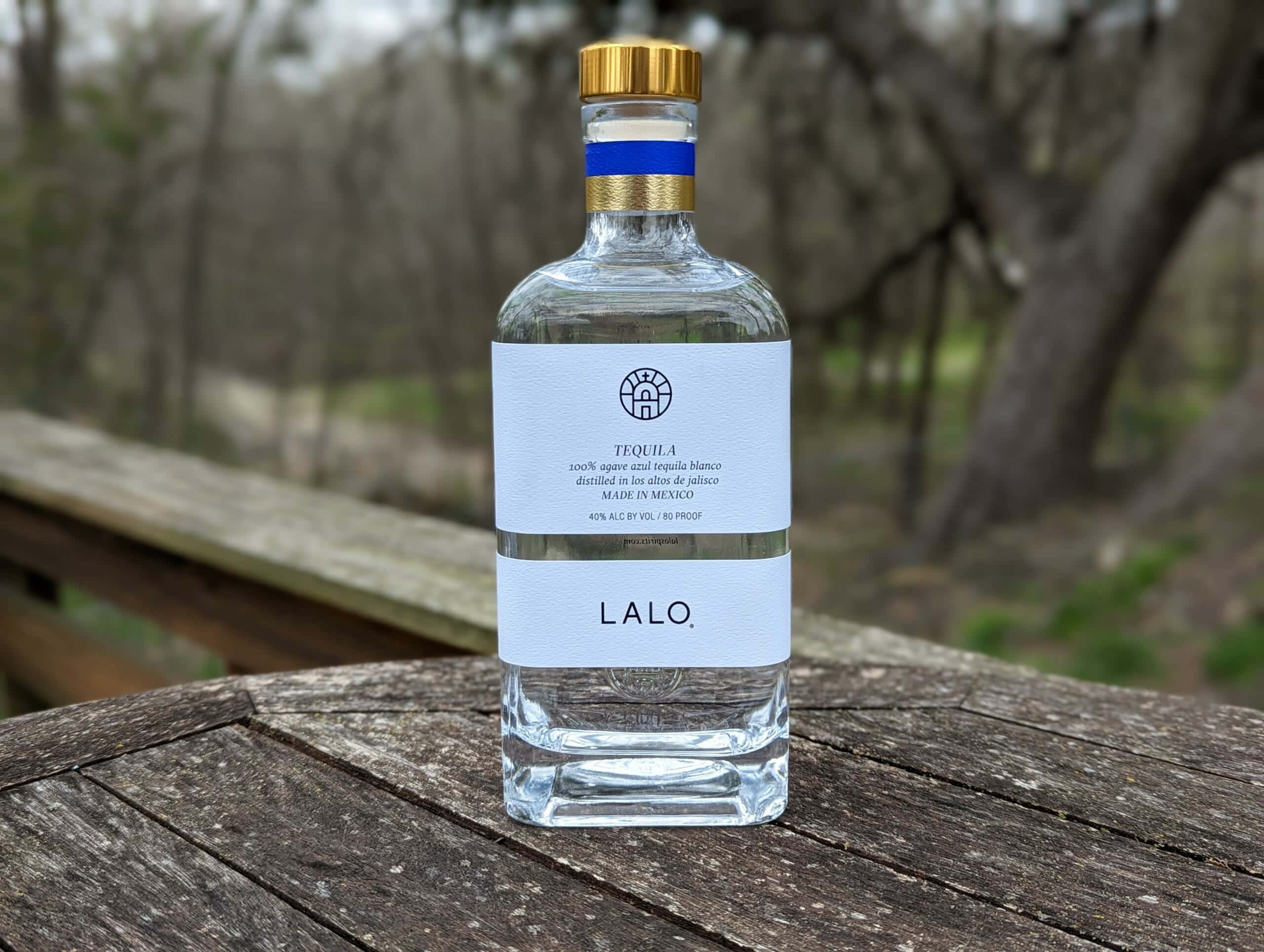 Lalo Tequila, clear glass bottle, gold cap, 2K Desktop Wallpaper