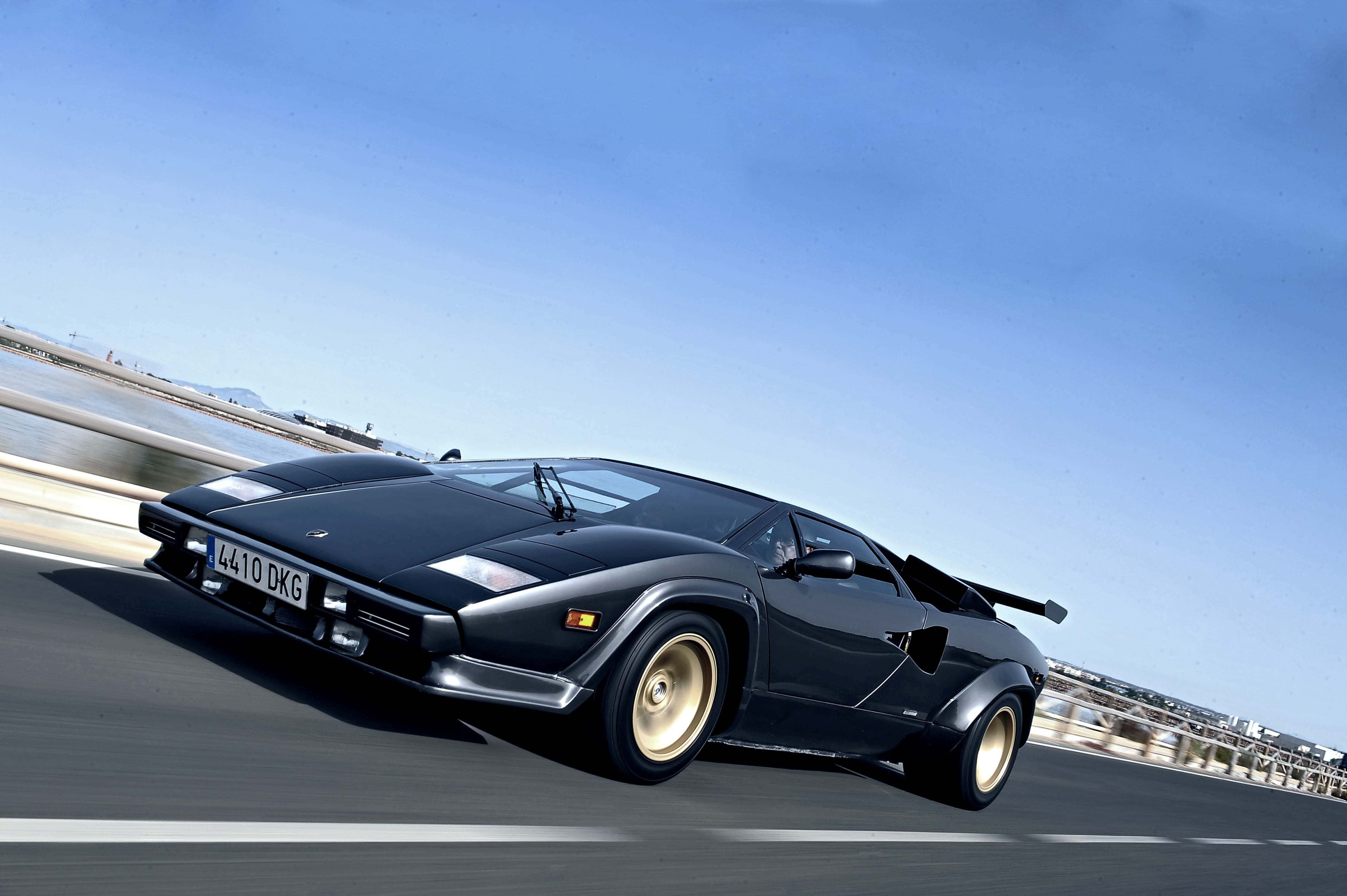 Lamborghini Countach, black, coastal highway, 4K Desktop Wallpaper