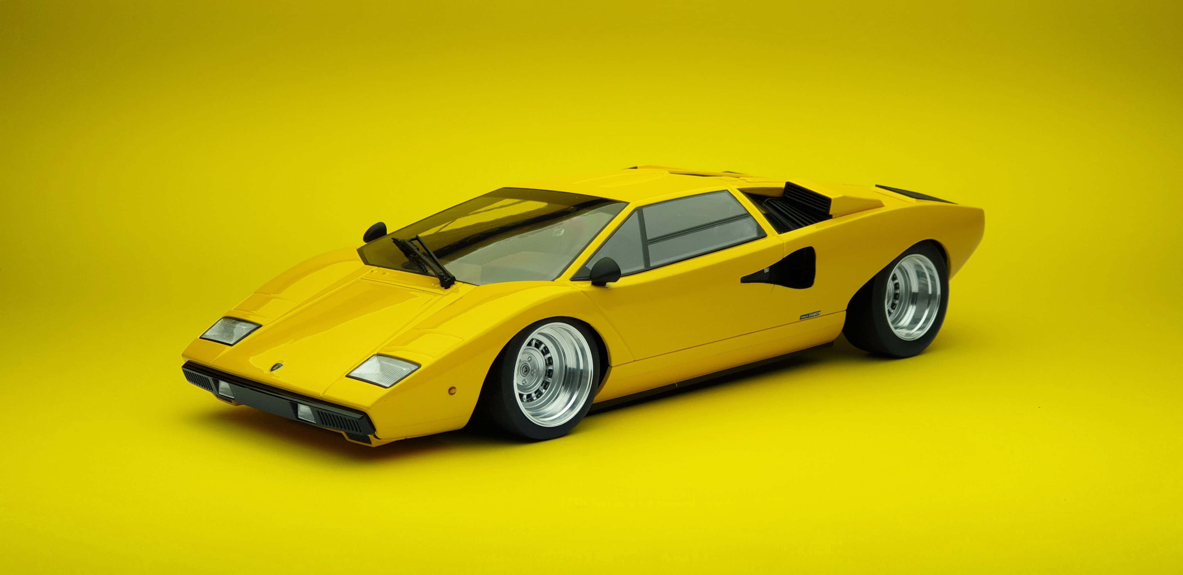 Lamborghini Countach, vibrant yellow, silver rims, 4K Desktop Wallpaper