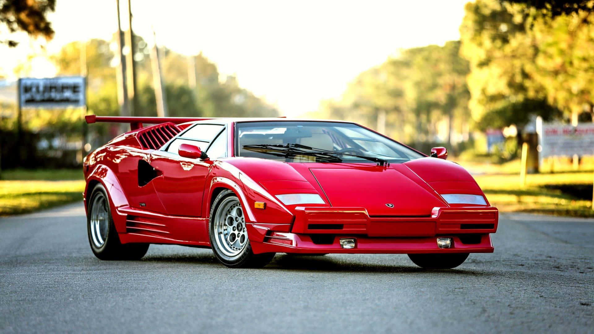 Lamborghini Countach, vibrant red, sunlit road, Full HD Desktop Wallpaper