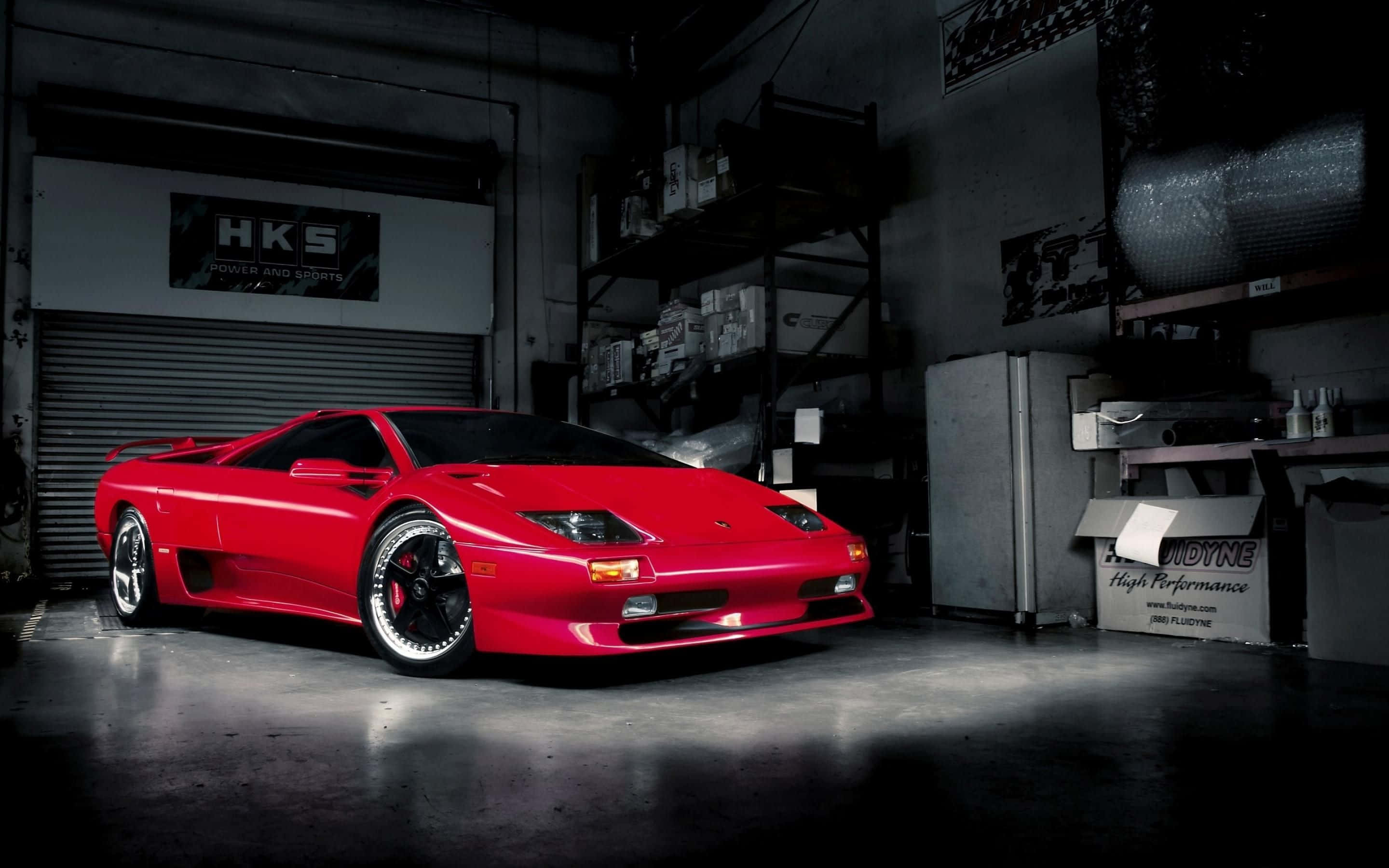 Lamborghini Diablo, vibrant red, dramatic spotlight, 2K Desktop Wallpaper