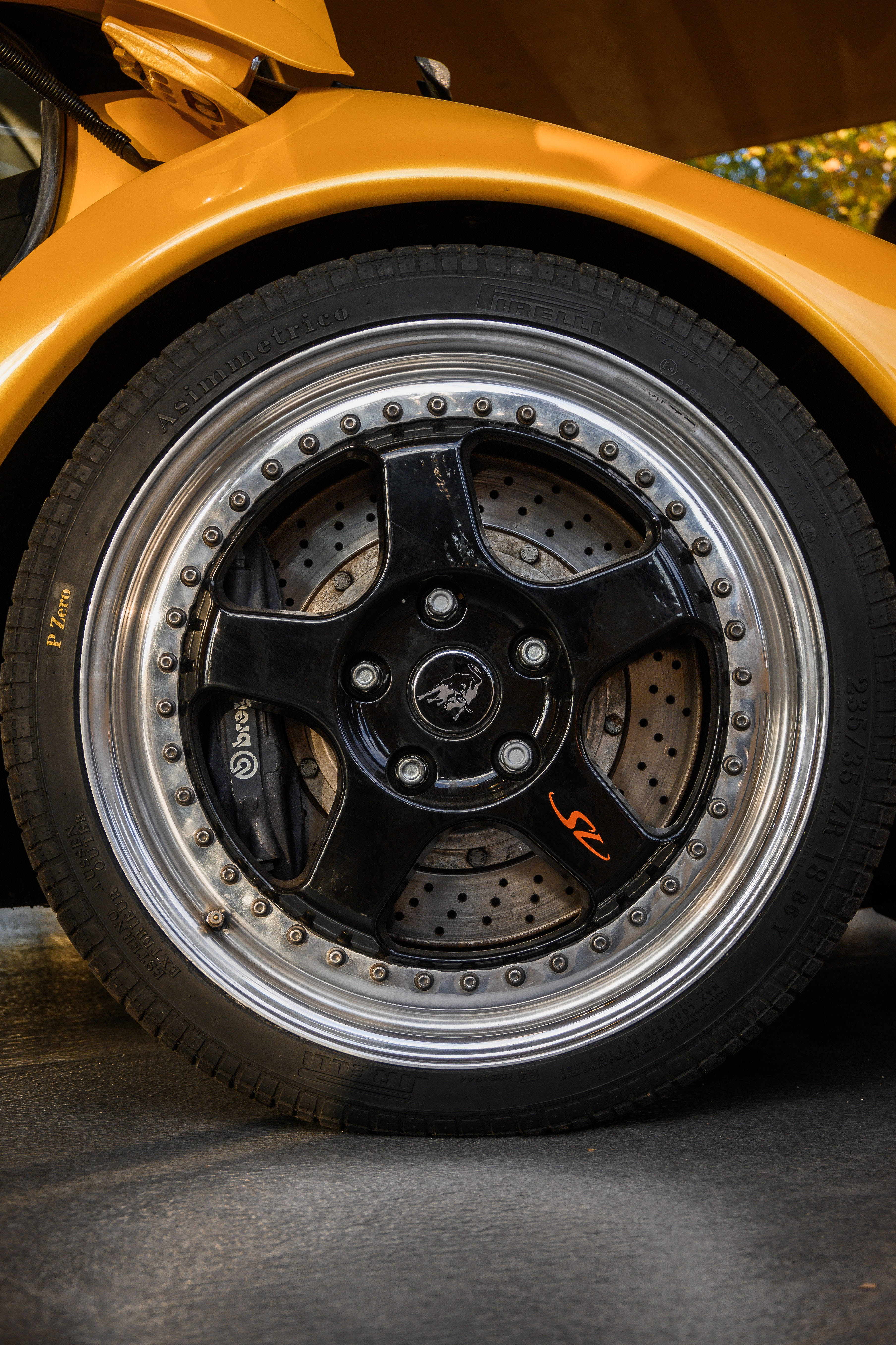 Lamborghini Galaxy, vibrant yellow sports car, black alloy rim, 5K Phone Wallpaper