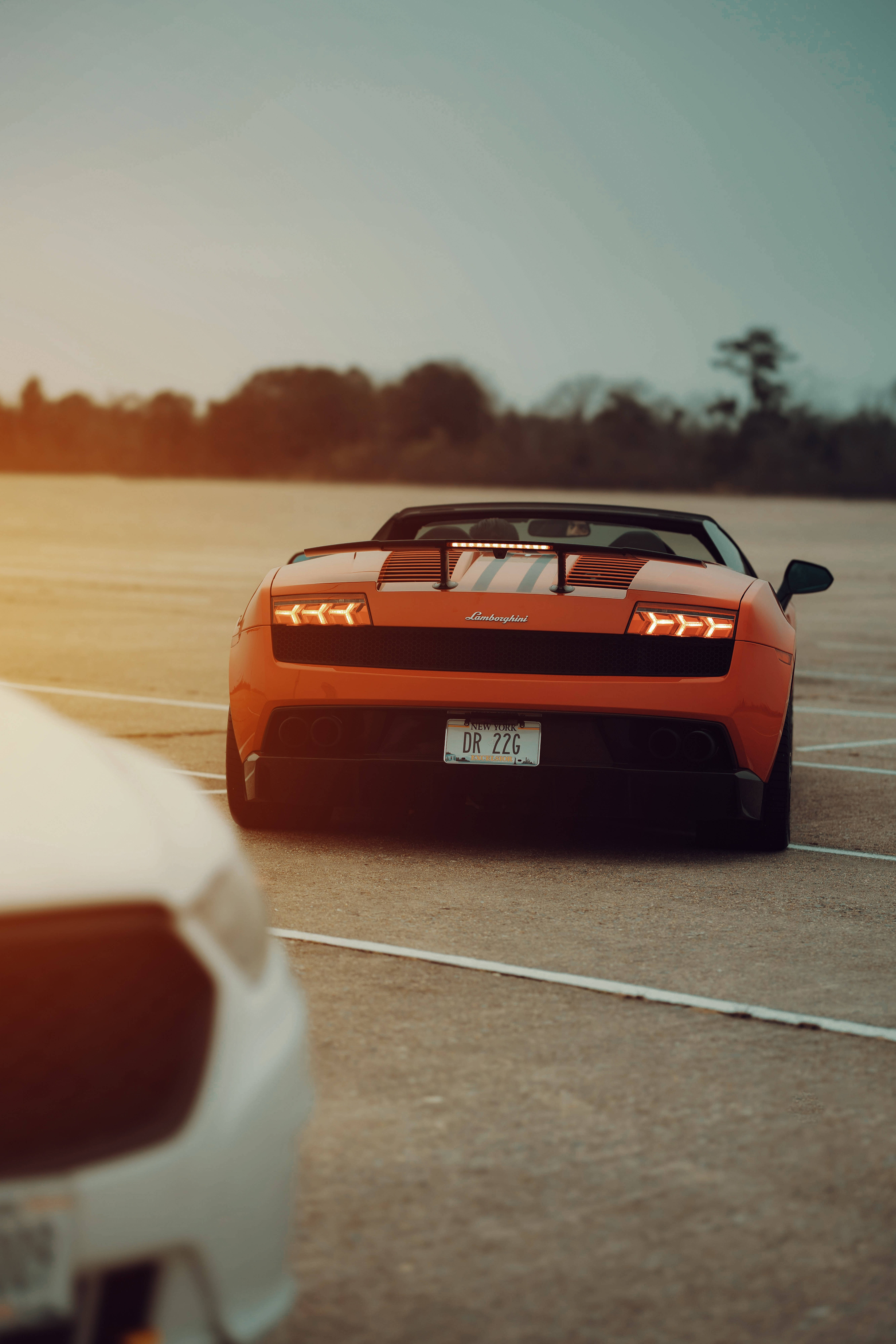 Lamborghini Galaxy, orange, sunlit parking lot, 8K Phone Wallpaper