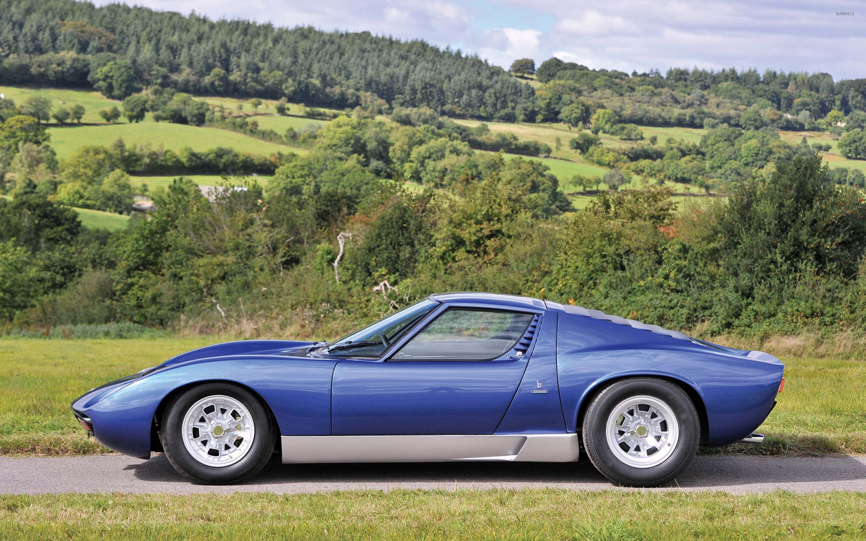 Lamborghini Miura, sleek blue, rural road, 2K Desktop Wallpaper