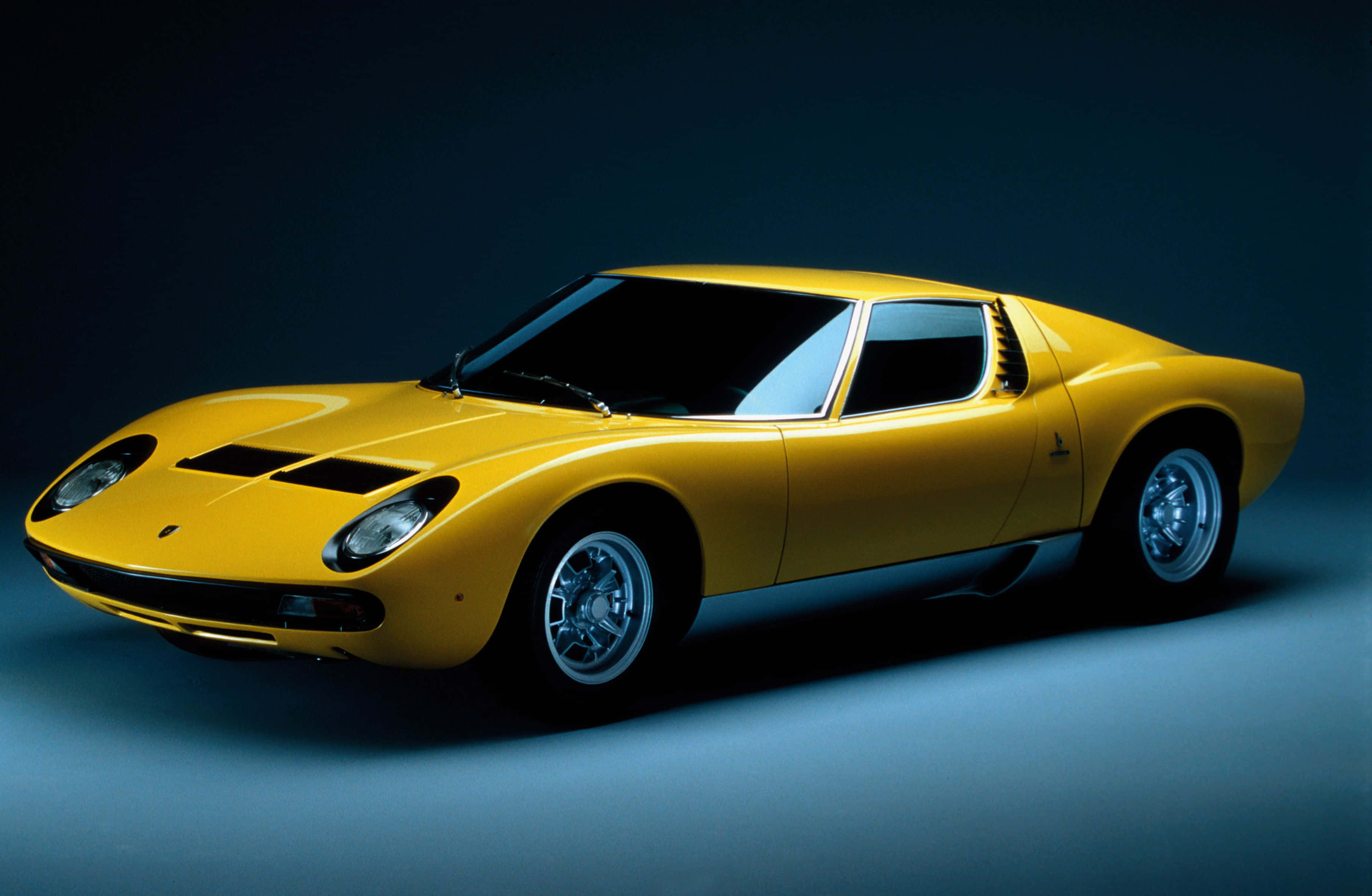 Lamborghini Miura, vibrant yellow, studio lights, 2K Desktop Wallpaper