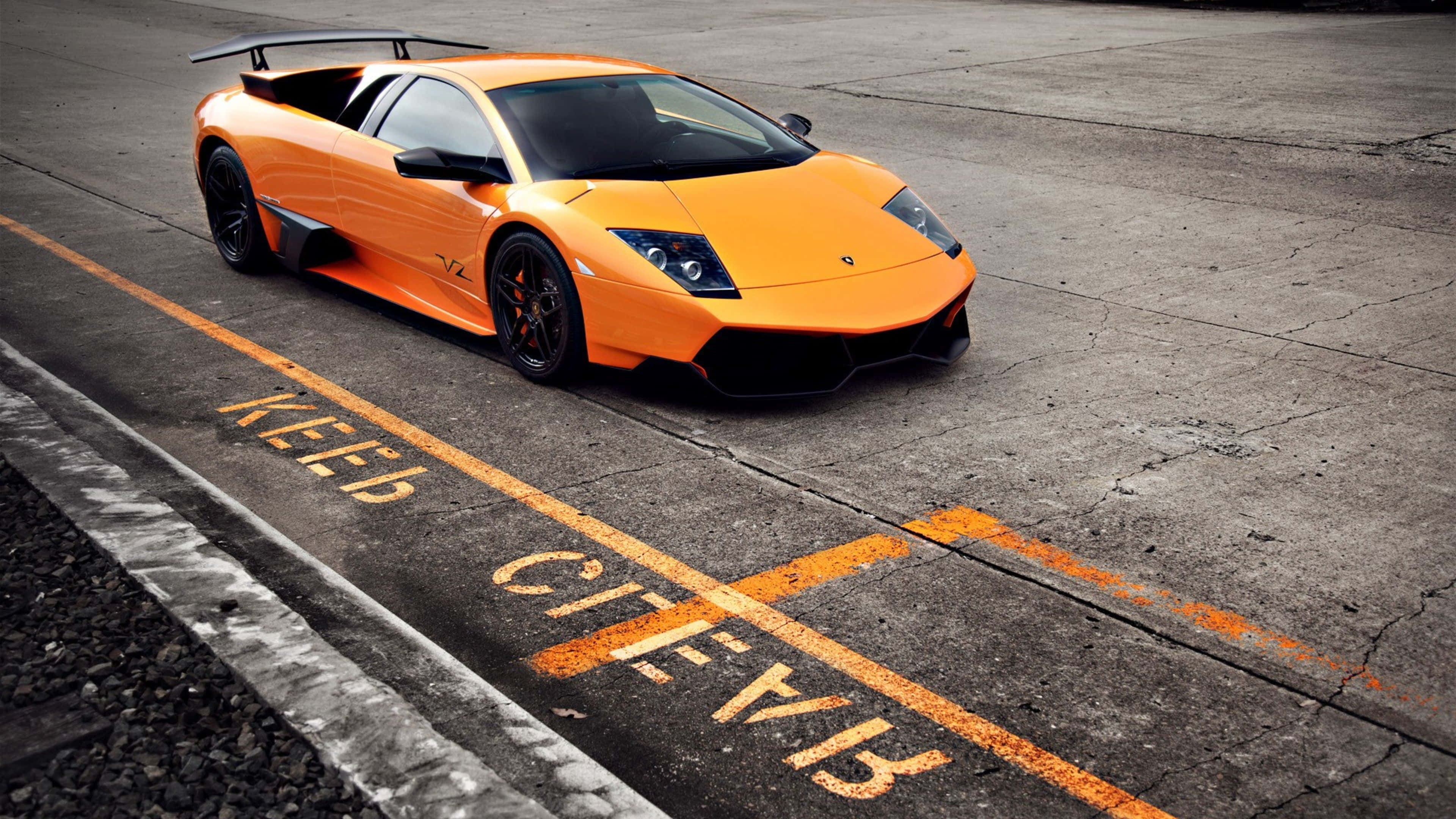Lamborghini Murciélago, vibrant orange, cracked asphalt track, 4K Desktop Wallpaper