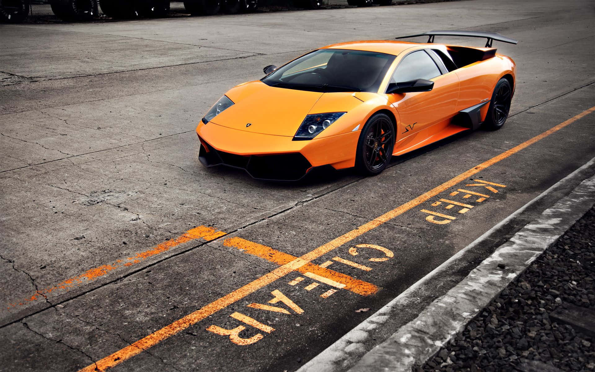 Lamborghini Murciélago, vibrant orange, cracked concrete lot, Full HD Desktop Wallpaper