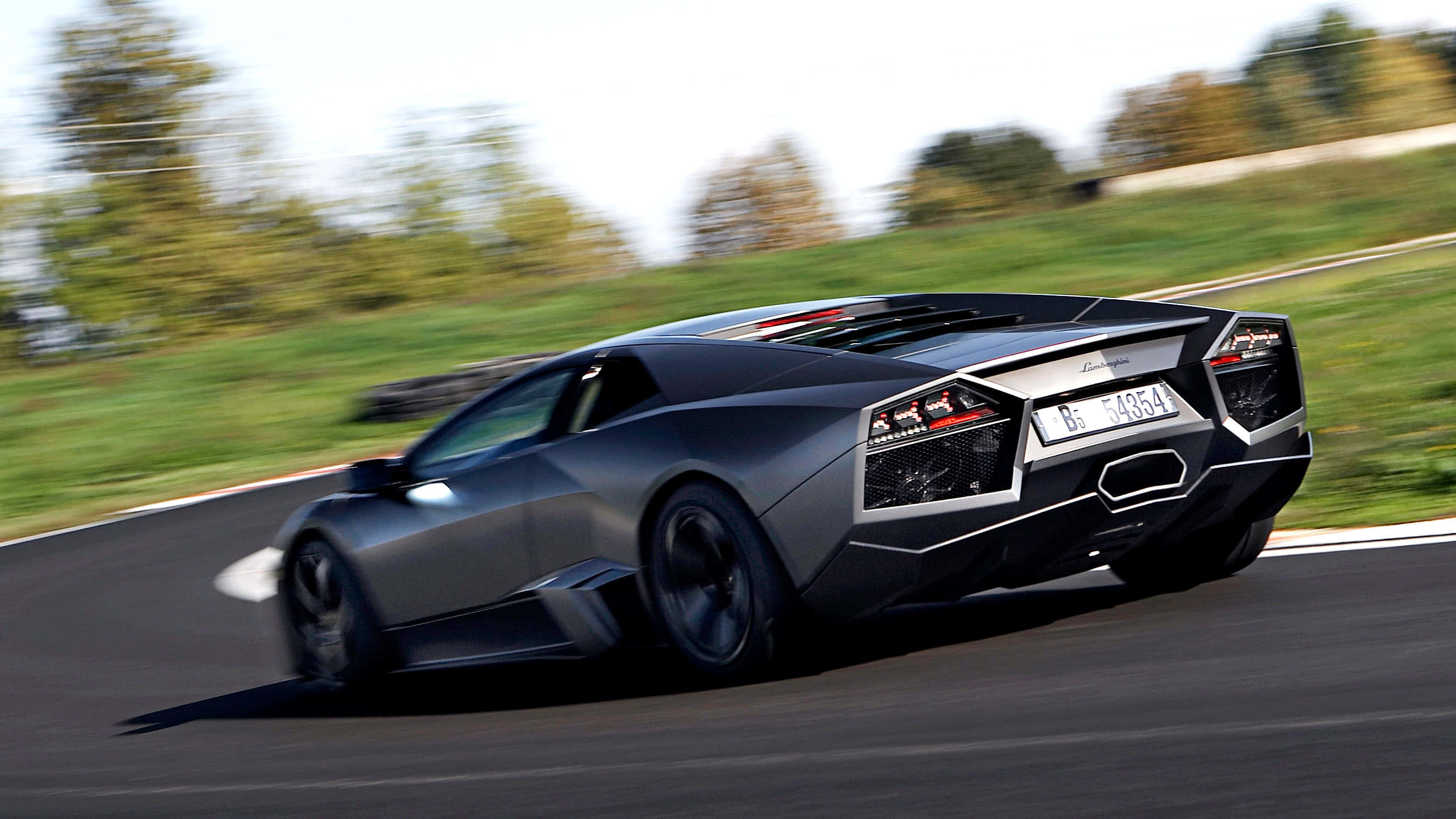 Lamborghini Reventón, matte gray, curving asphalt road, 2K Desktop Wallpaper