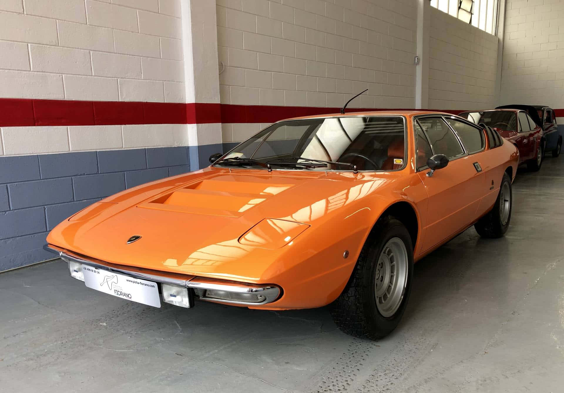 Lamborghini Urraco, vibrant orange, clean indoor garage, Full HD Desktop Wallpaper