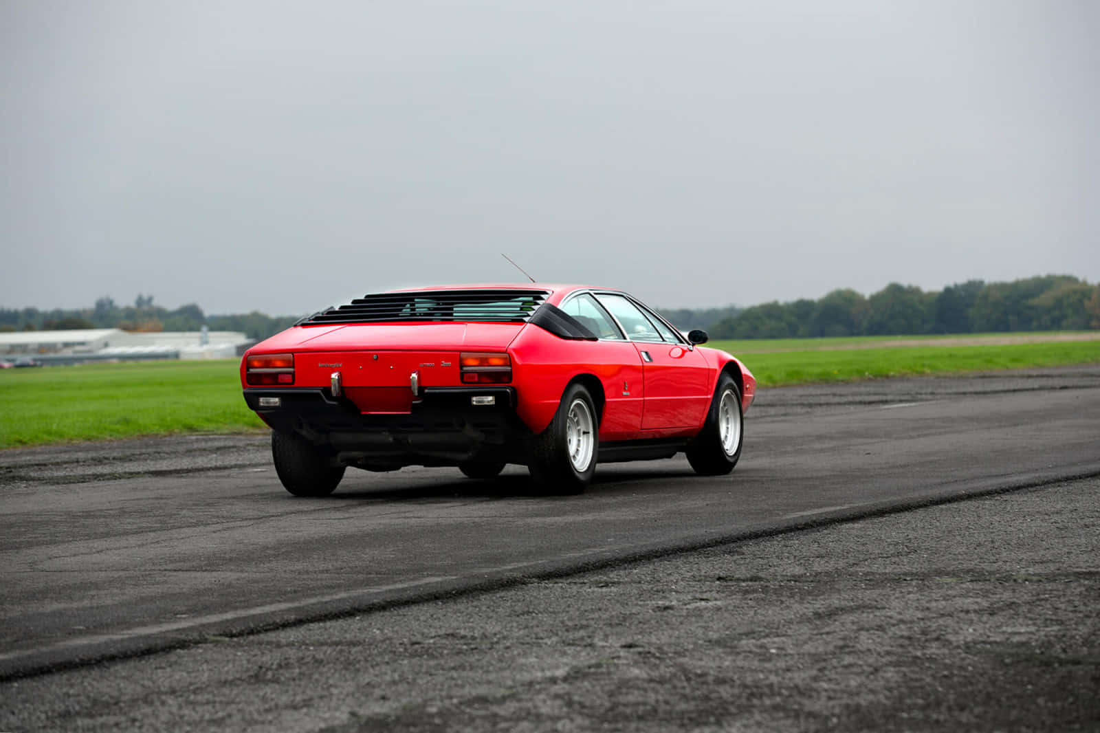 Lamborghini Urraco, vibrant red, wet asphalt runway, HD Desktop Wallpaper