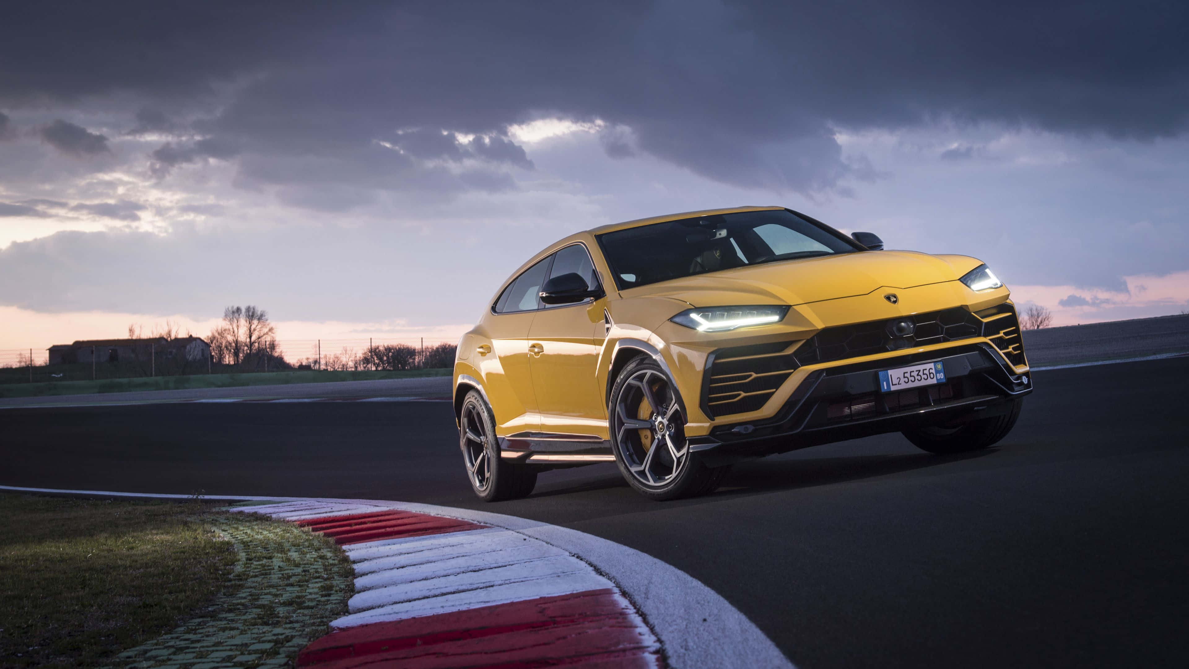 Lamborghini Urus, vibrant yellow, racetrack corner, 4K Desktop Wallpaper