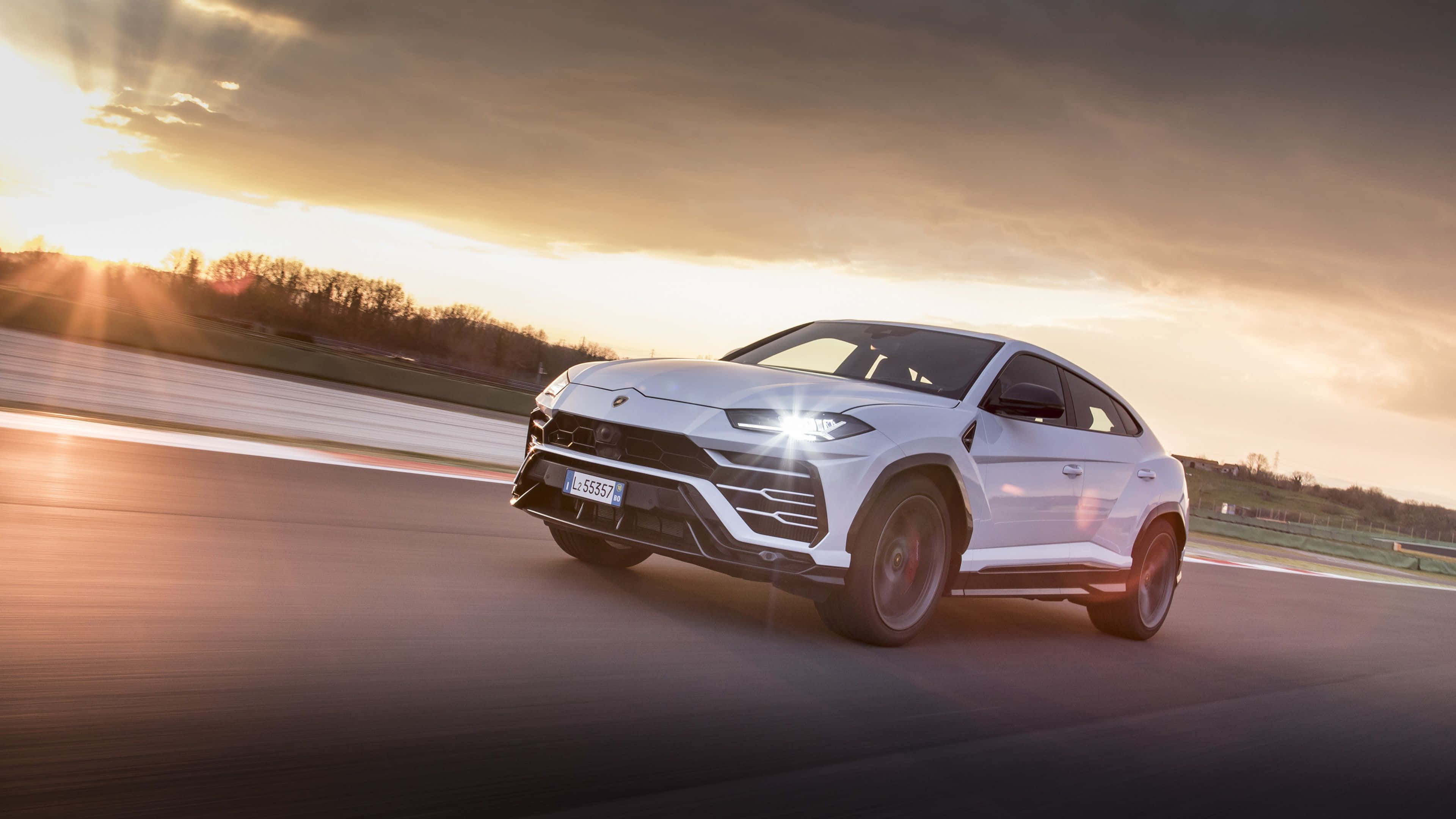 Lamborghini Urus, racetrack, sunset, 4K Desktop Wallpaper