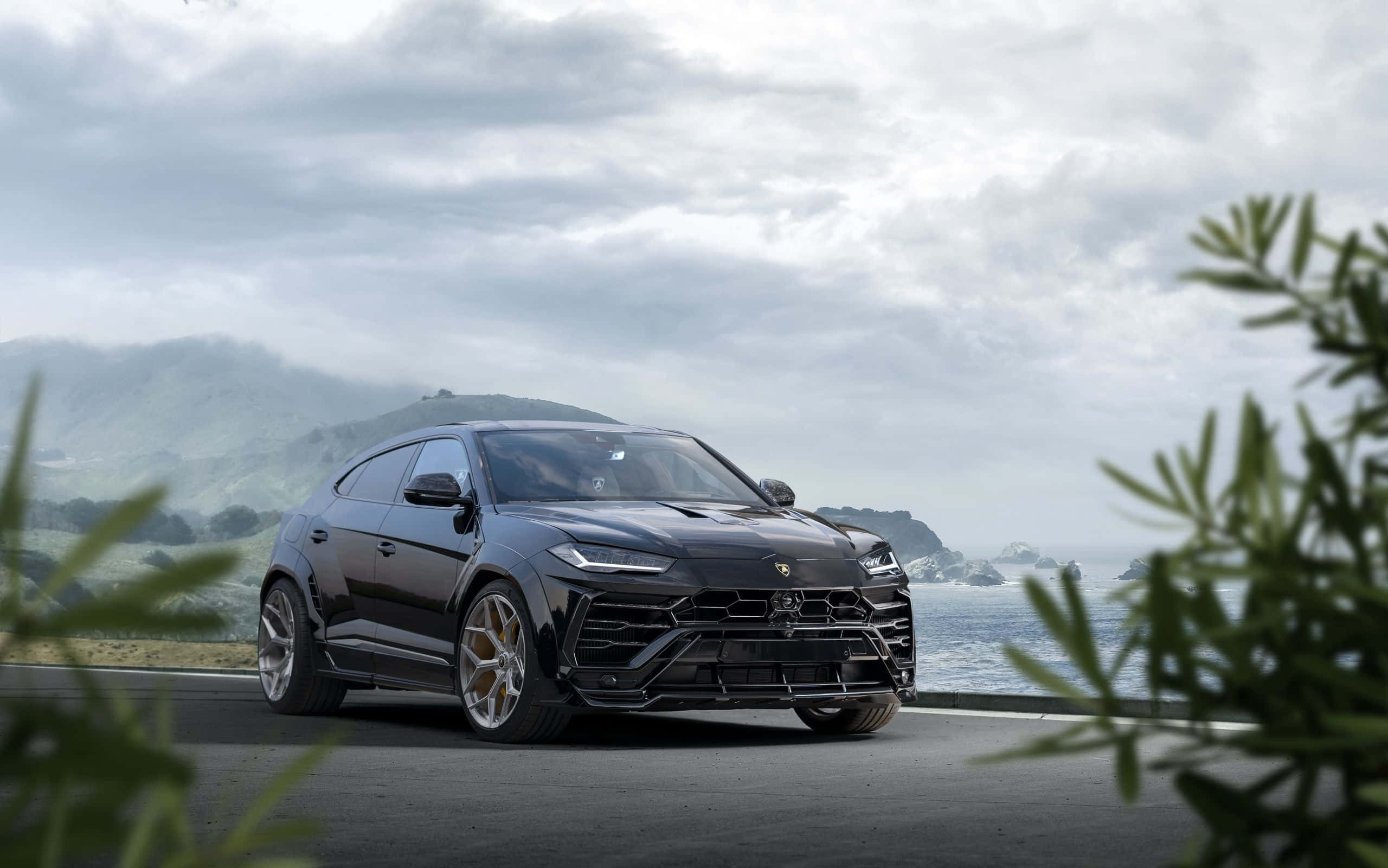 Lamborghini Urus, black, coastal road, 2K Desktop Wallpaper