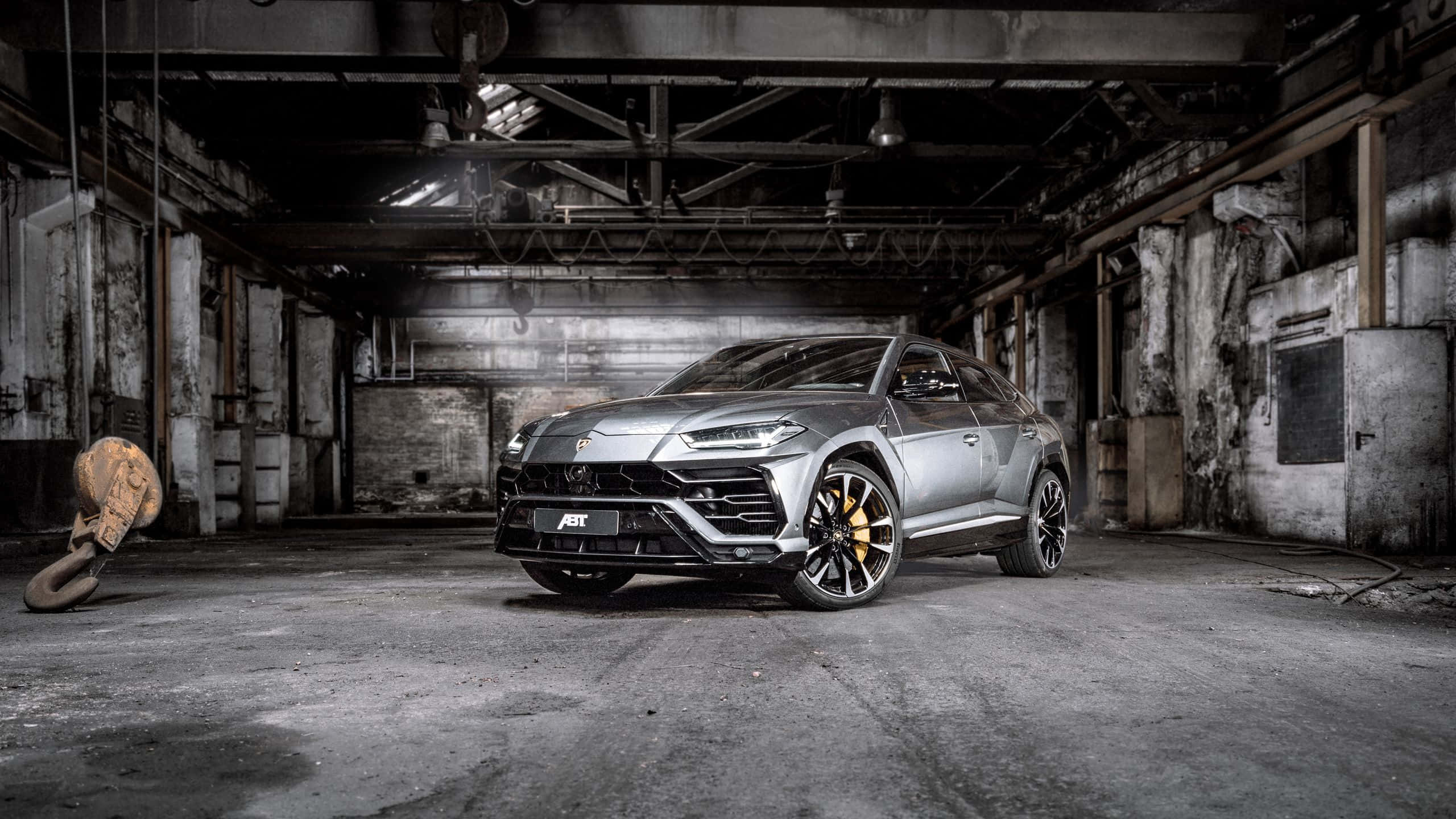 Lamborghini Urus, silver, abandoned industrial warehouse, 2K Desktop Wallpaper