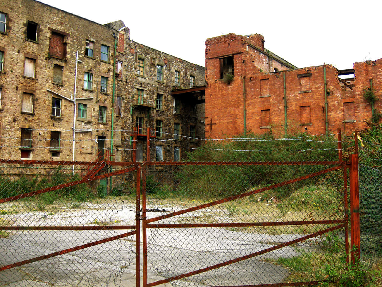 derelict building, rusted chain-link fence, crumbling brick buildings, HD Desktop Wallpaper