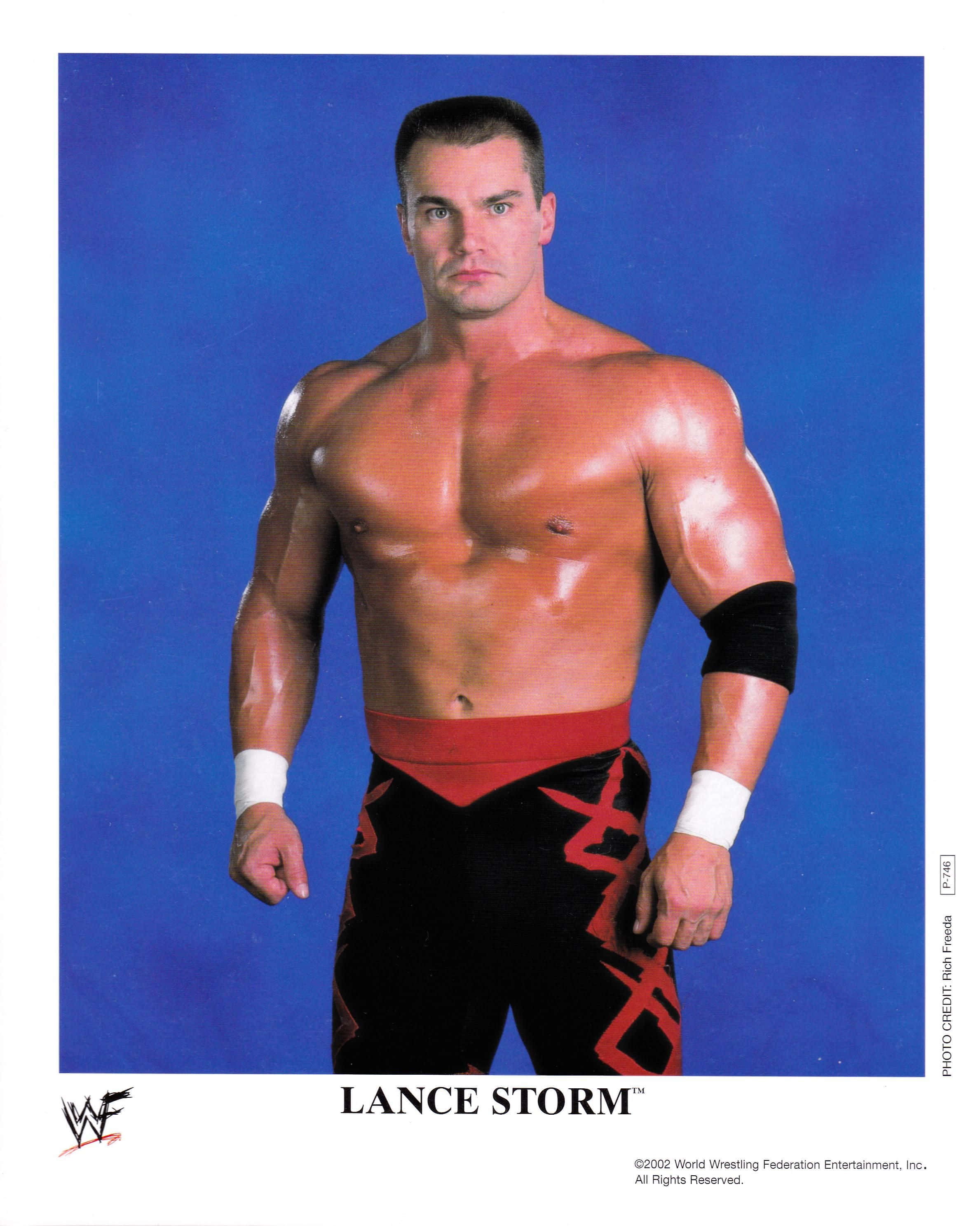 Lance Storm, muscular wrestler, solid blue studio backdrop, 2K Phone Wallpaper