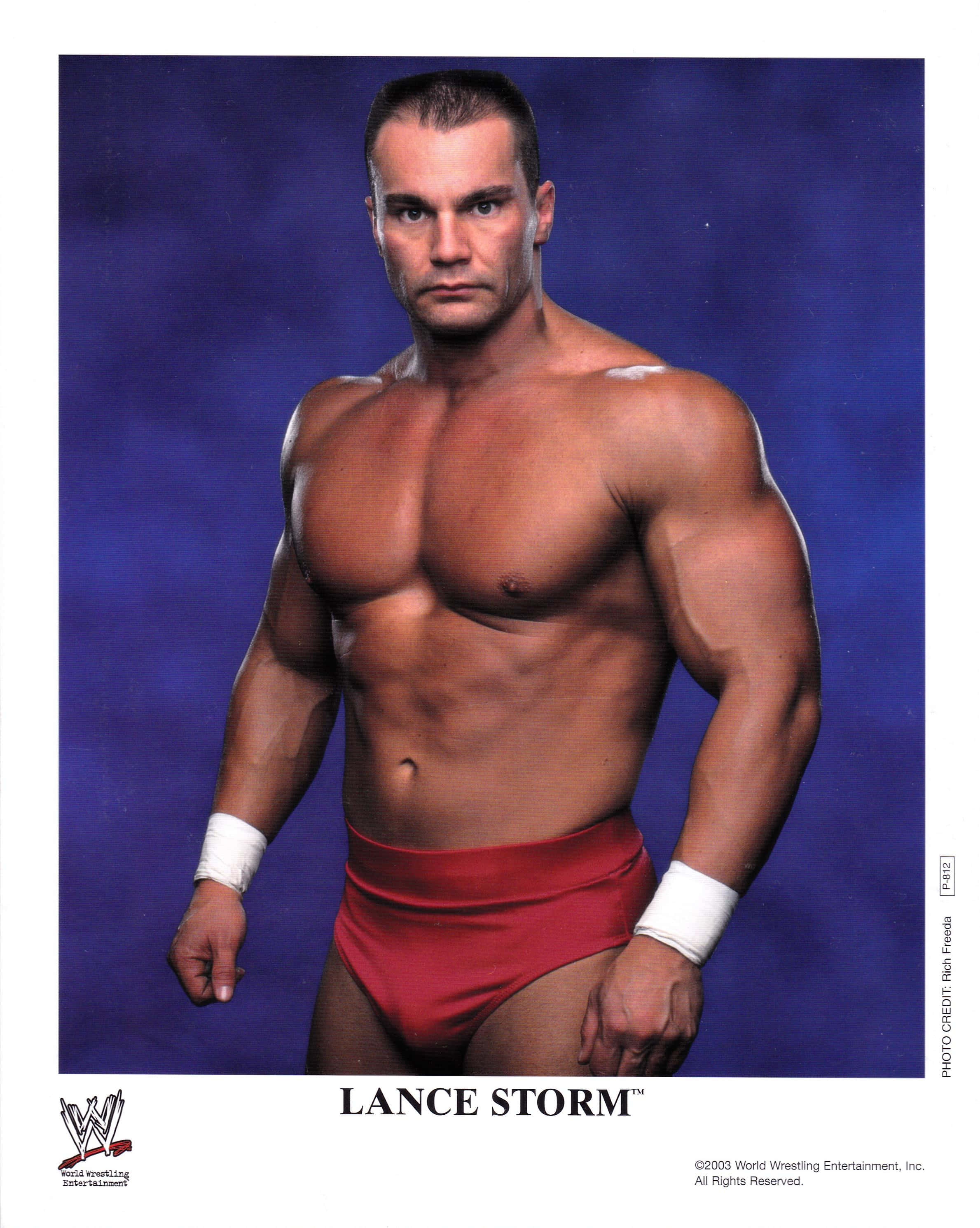 Lance Storm, red trunks, deep blue studio backdrop, 2K Phone Wallpaper