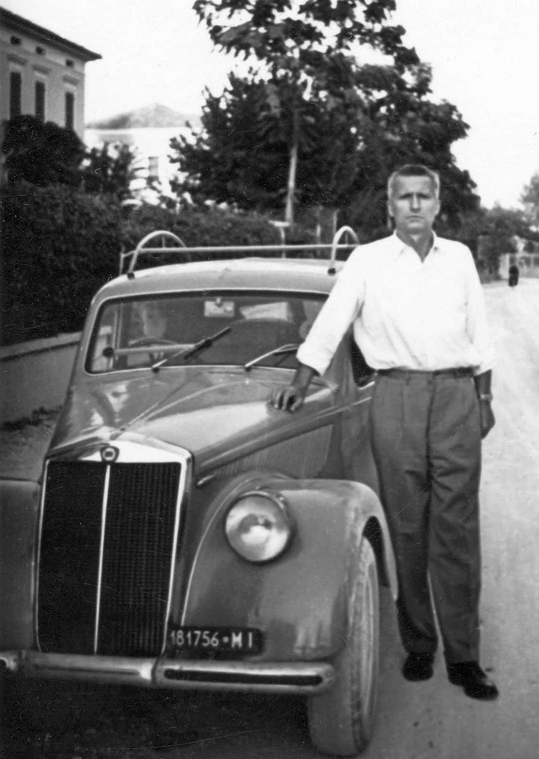 Lancia Aprilia, man standing, vintage car, HD Phone Wallpaper