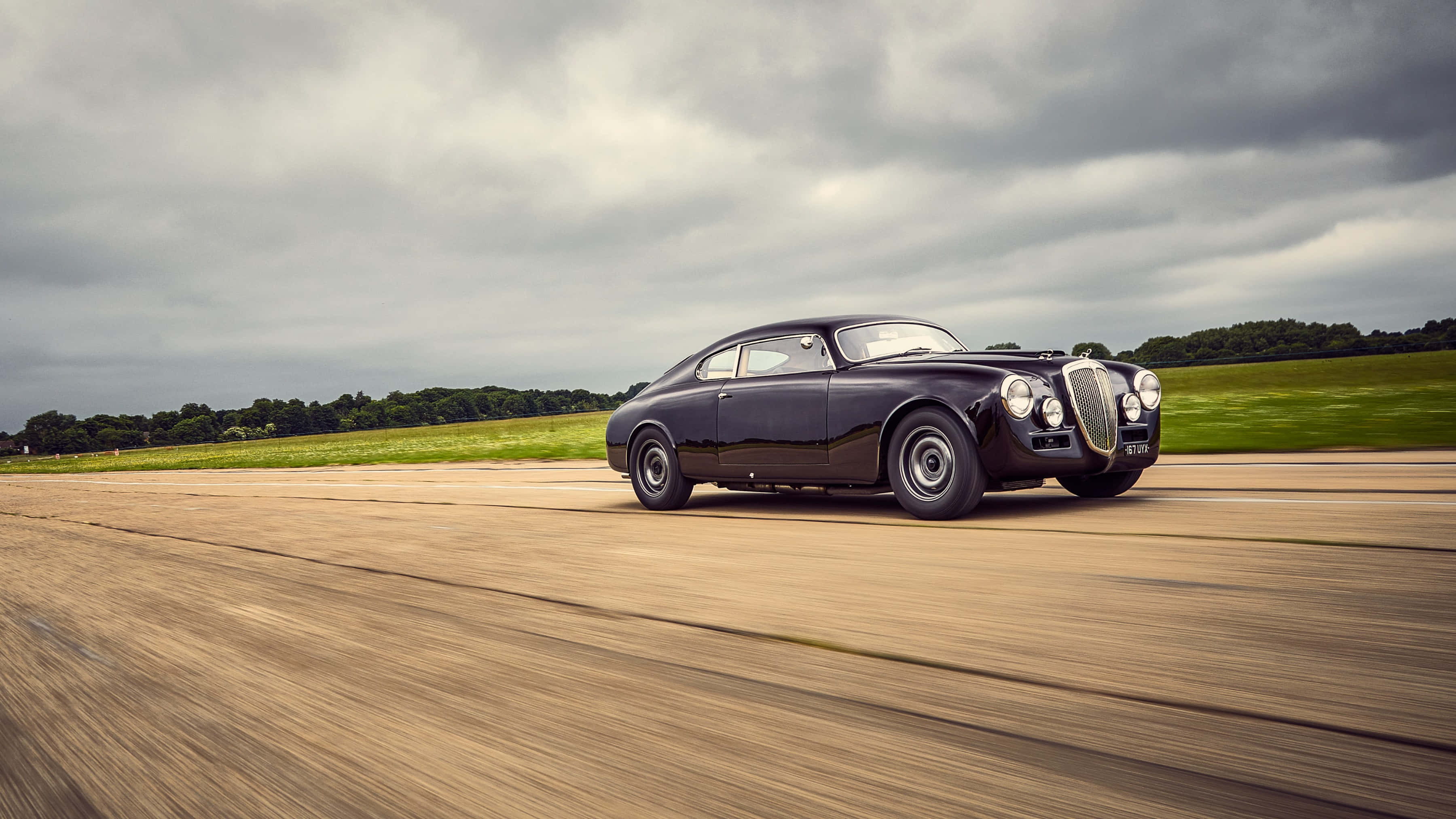 Lancia Aurelia, vintage black sports car, runway, 2K Desktop Wallpaper