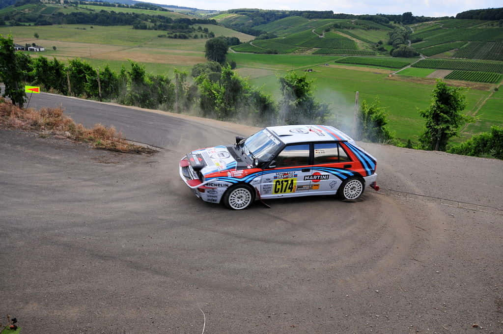 Lancia Delta, rally car, winding rural road, SD Desktop Wallpaper