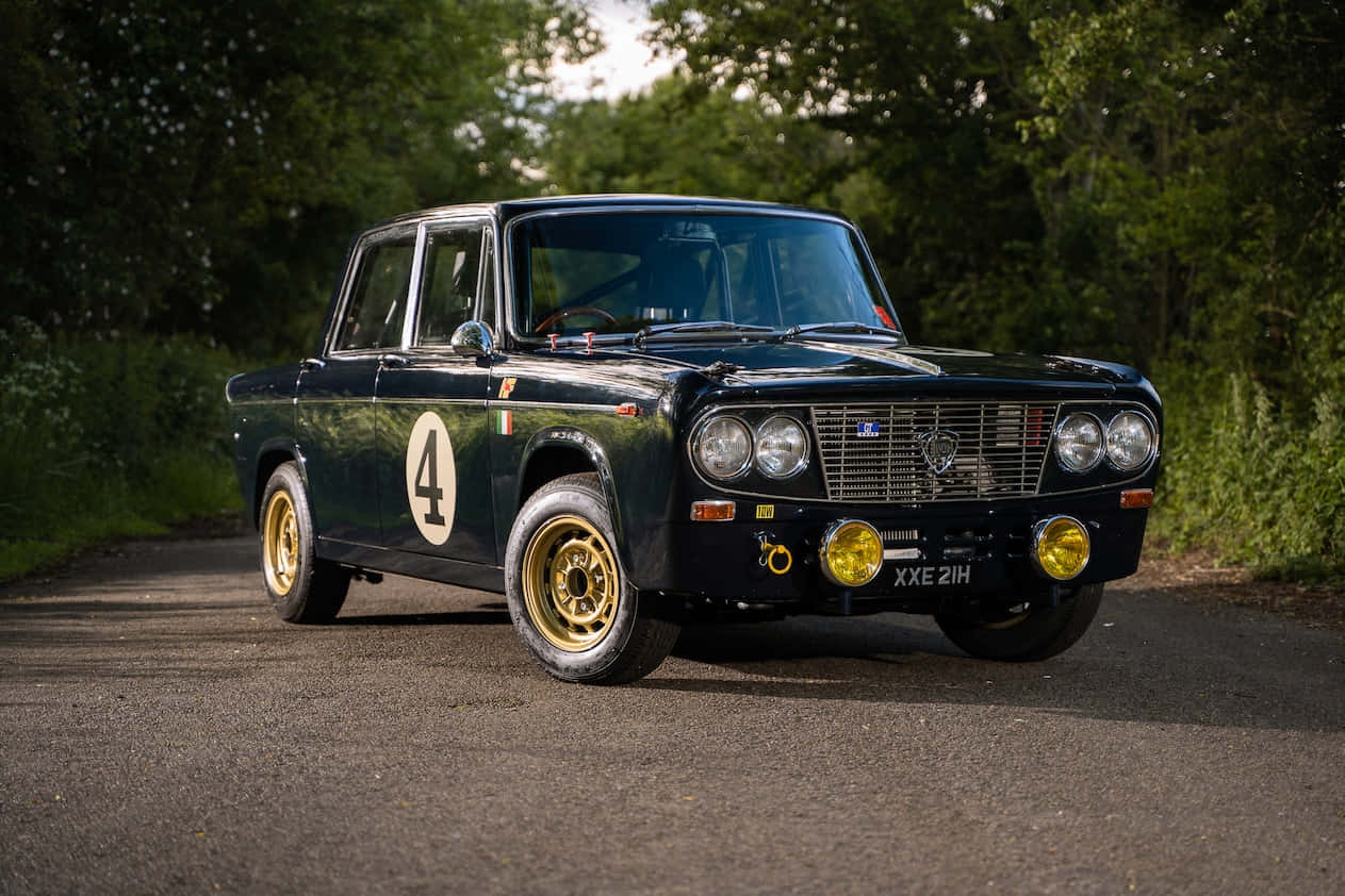Lancia Fulvia, dark blue, gold wheels, SD Desktop Wallpaper