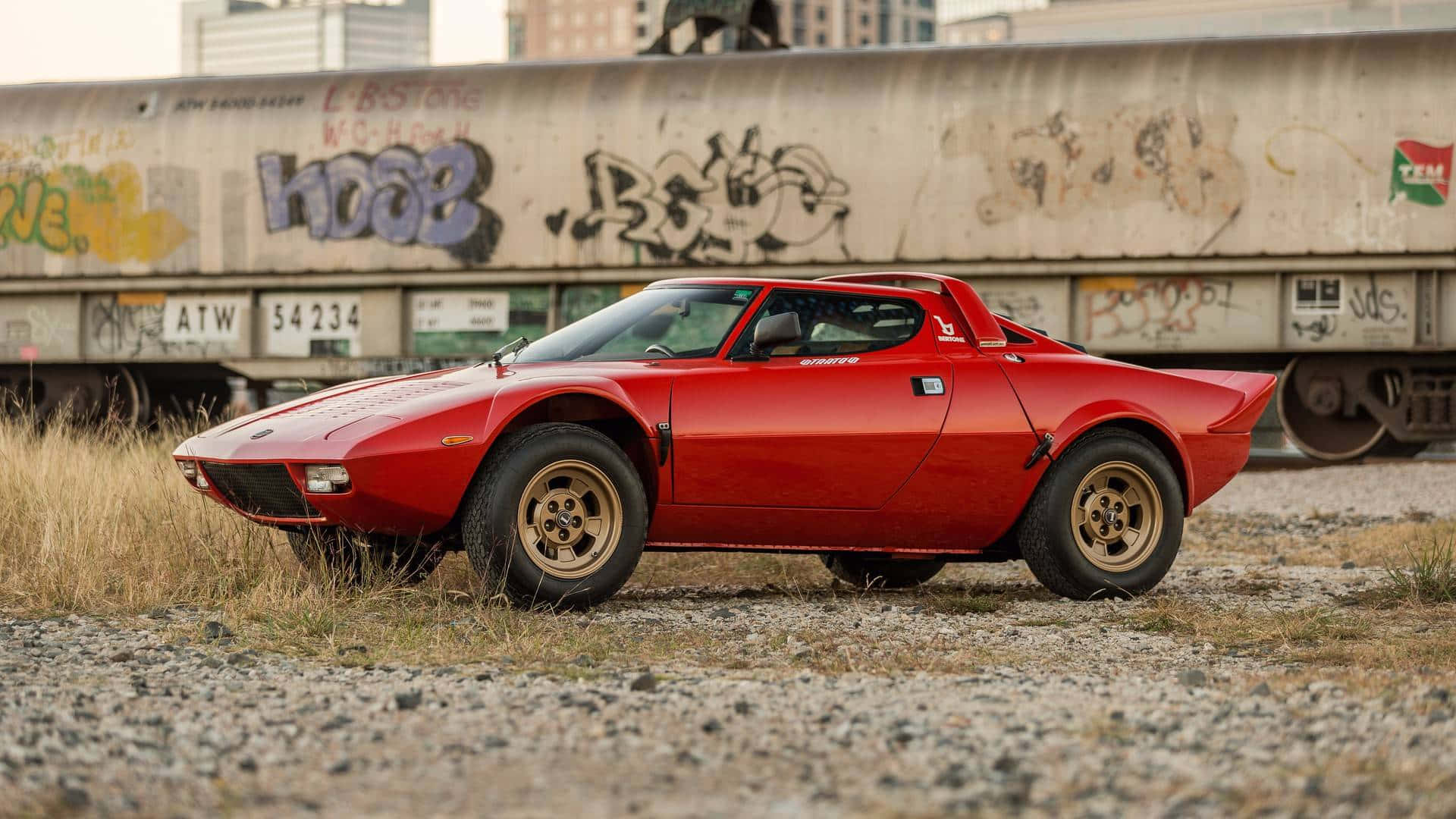 Red Lancia Stratos, classic sports car, gold rims, Full HD Desktop Wallpaper
