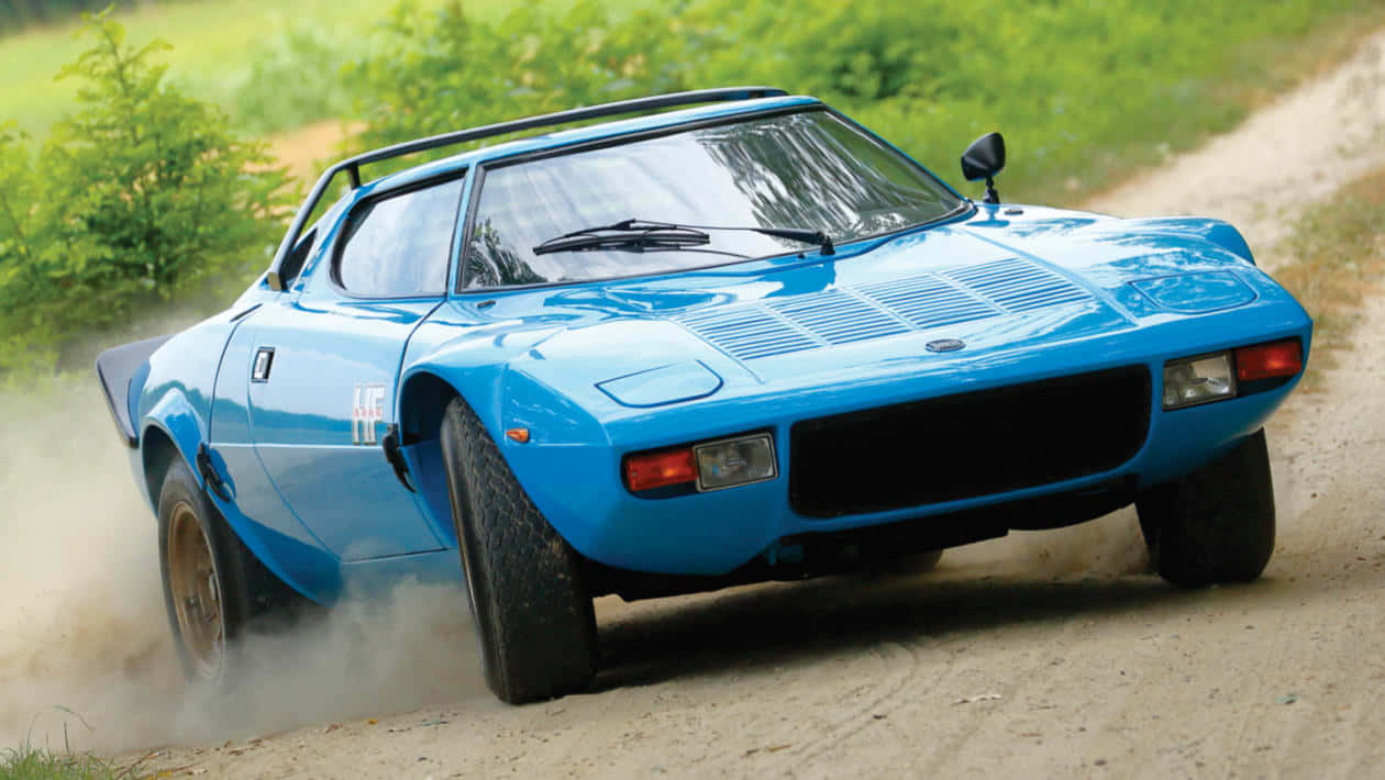 Lancia Stratos, blue, gravel road, SD Desktop Wallpaper
