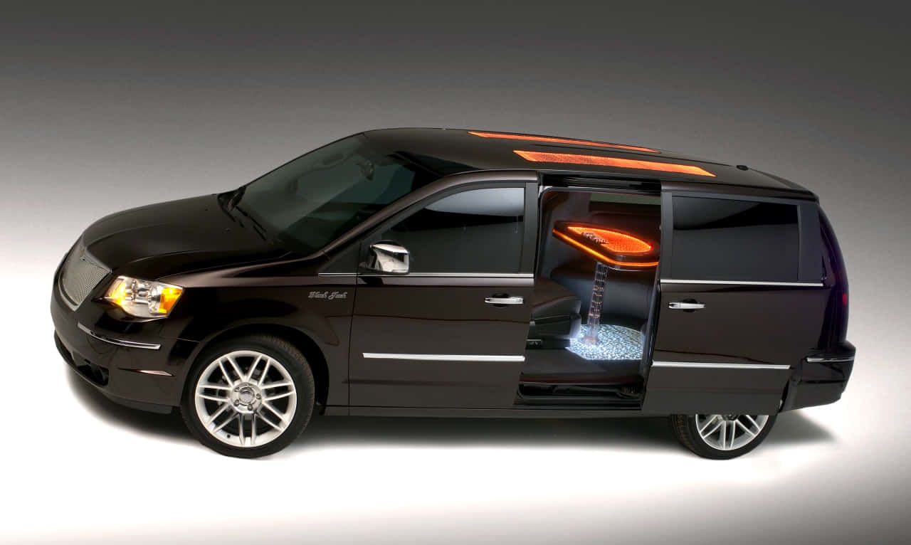 Lancia Voyager, sleek black luxury van, glowing orange interior, HD Desktop Wallpaper