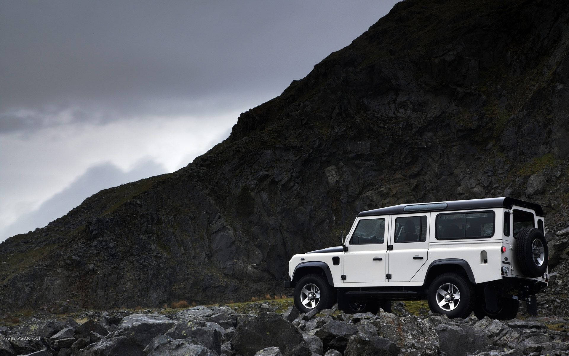 white Land Rover Defender, rocky terrain, moody overcast sky, Full HD Desktop Wallpaper