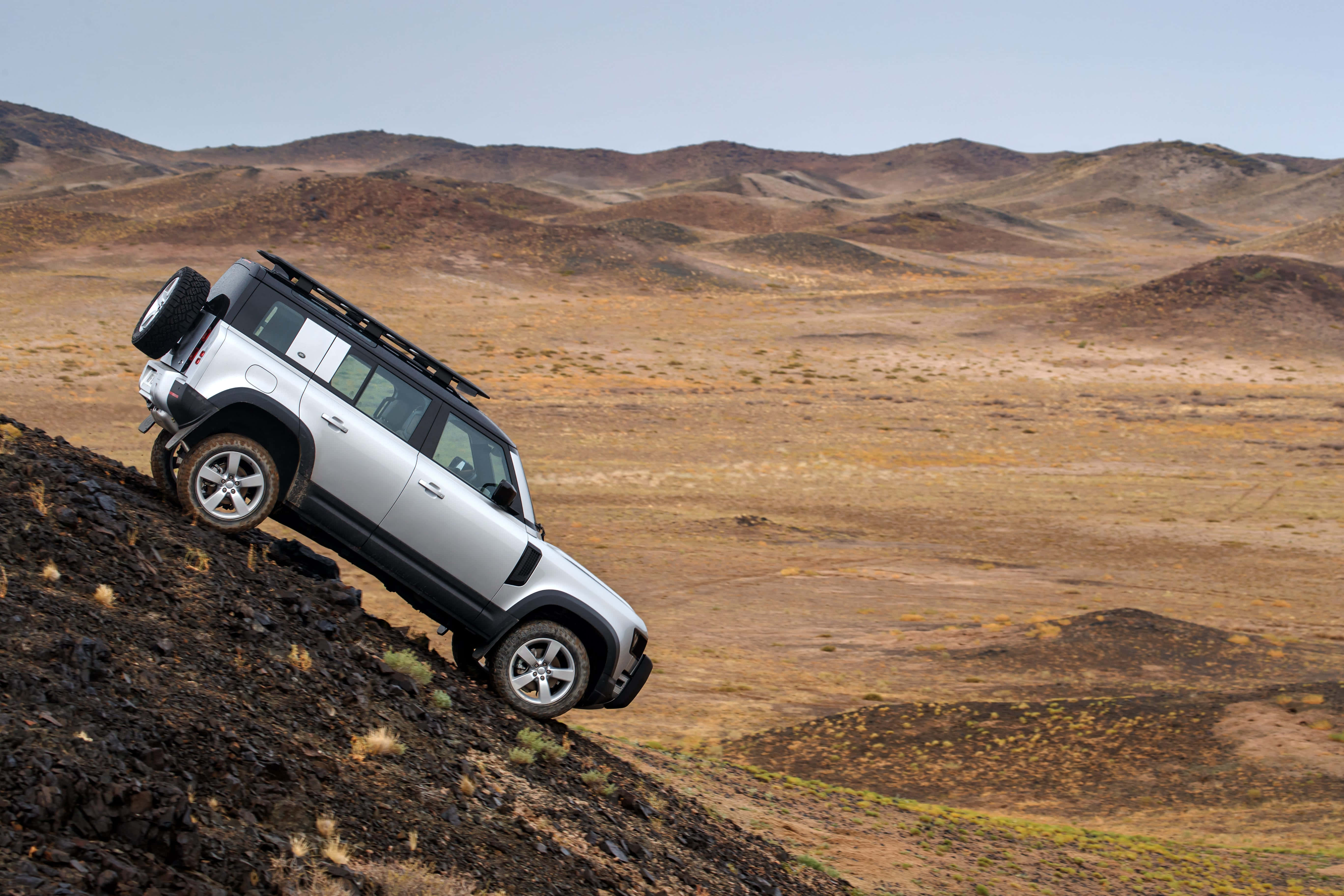 Land Rover Defender, silver, steep rocky slope, 5K Desktop Wallpaper