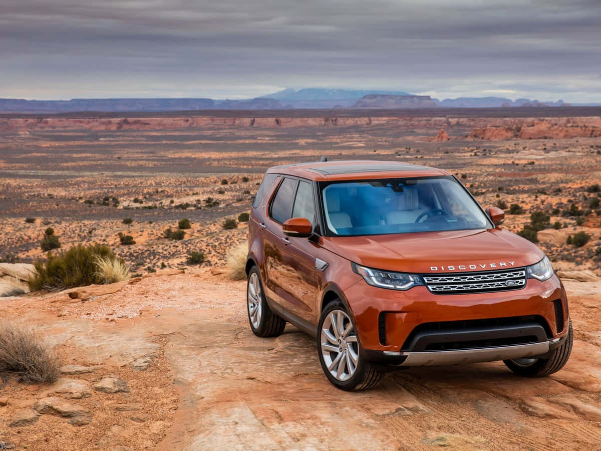 Land Rover Discovery, copper-colored, rocky desert trail, SD Desktop Wallpaper