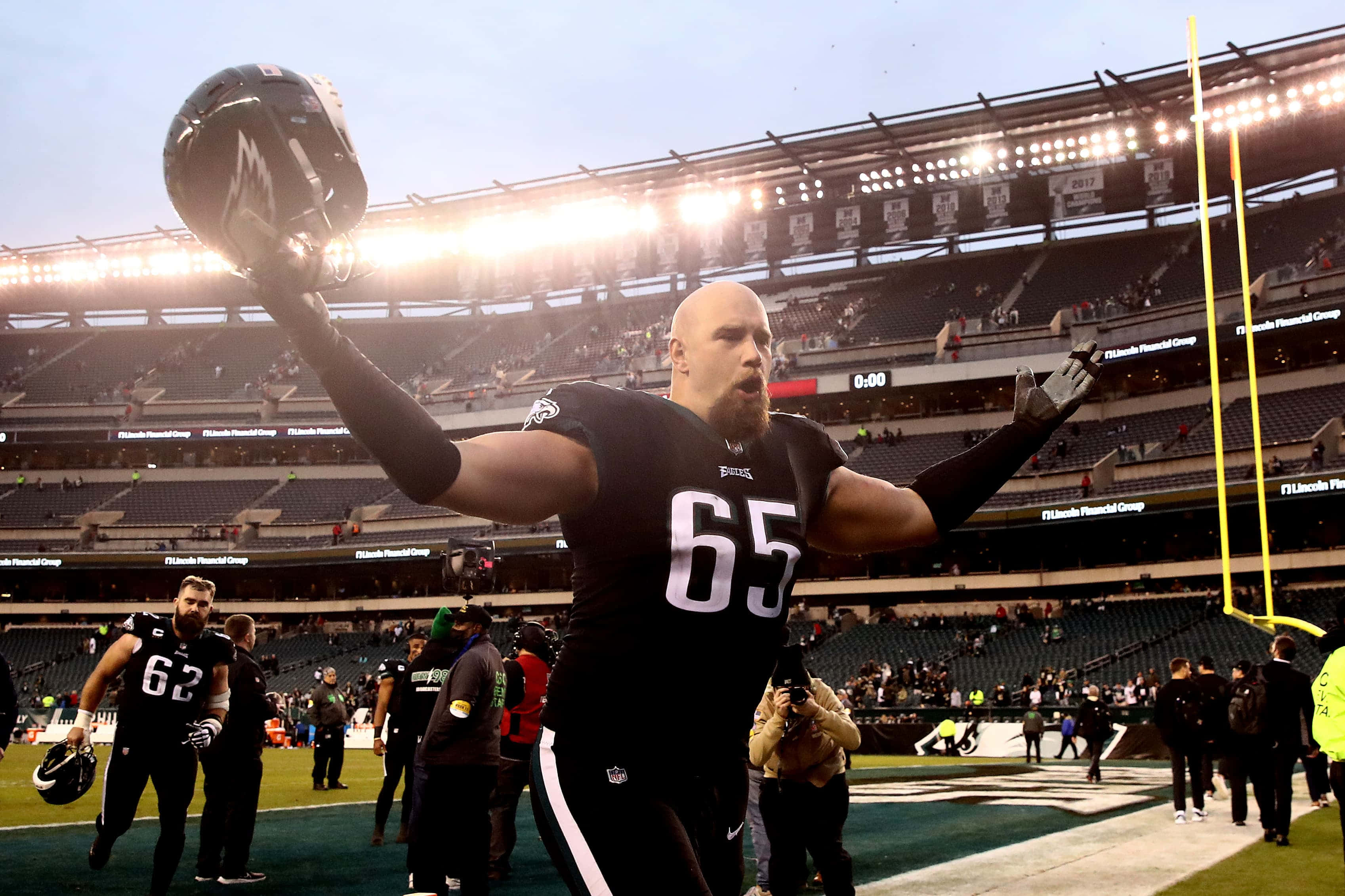 Lane Johnson, black jersey number 65, stadium field, 2K Desktop Wallpaper
