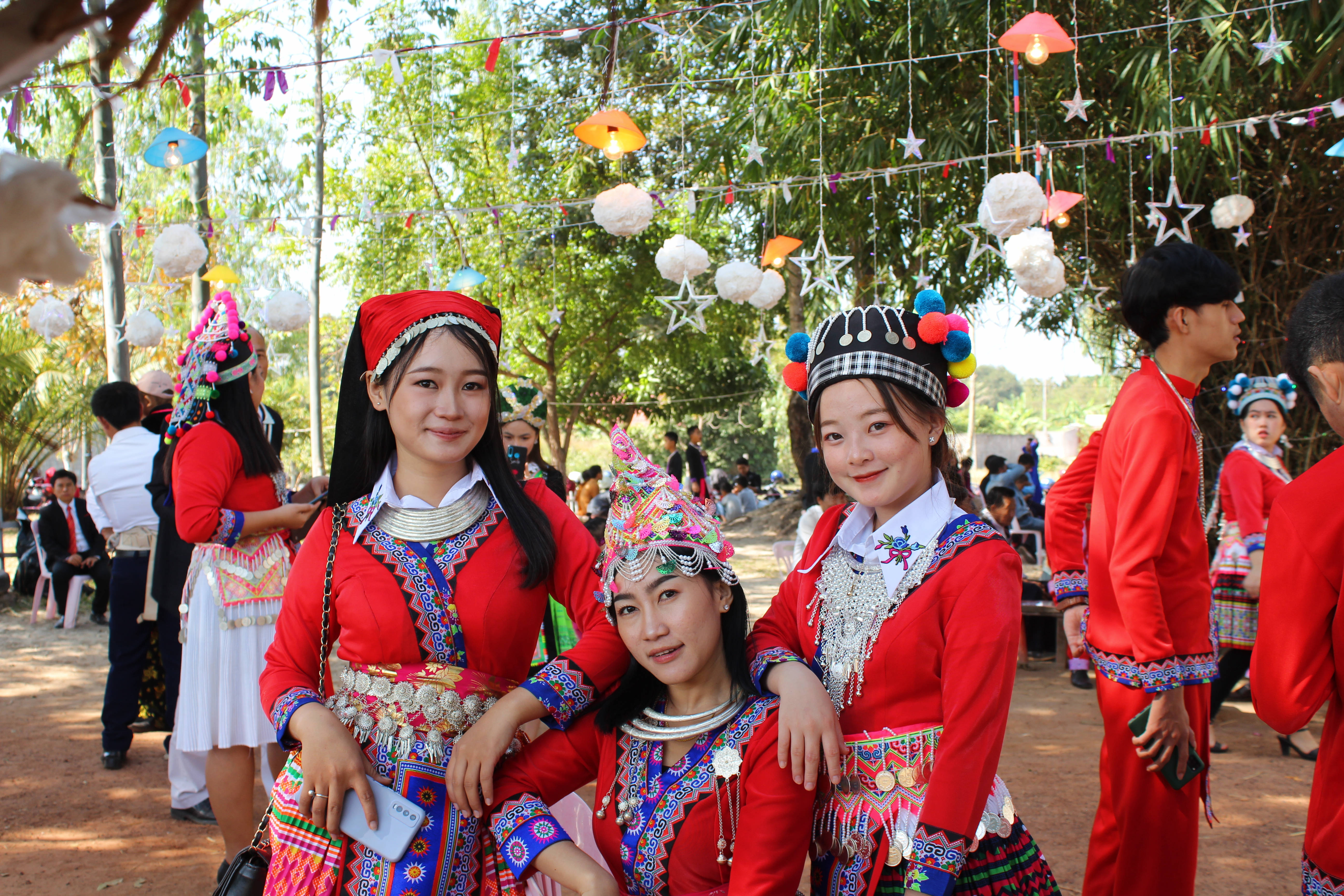 Laos, vibrant traditional red attire, intricate silver jewelry, 5K Desktop Wallpaper