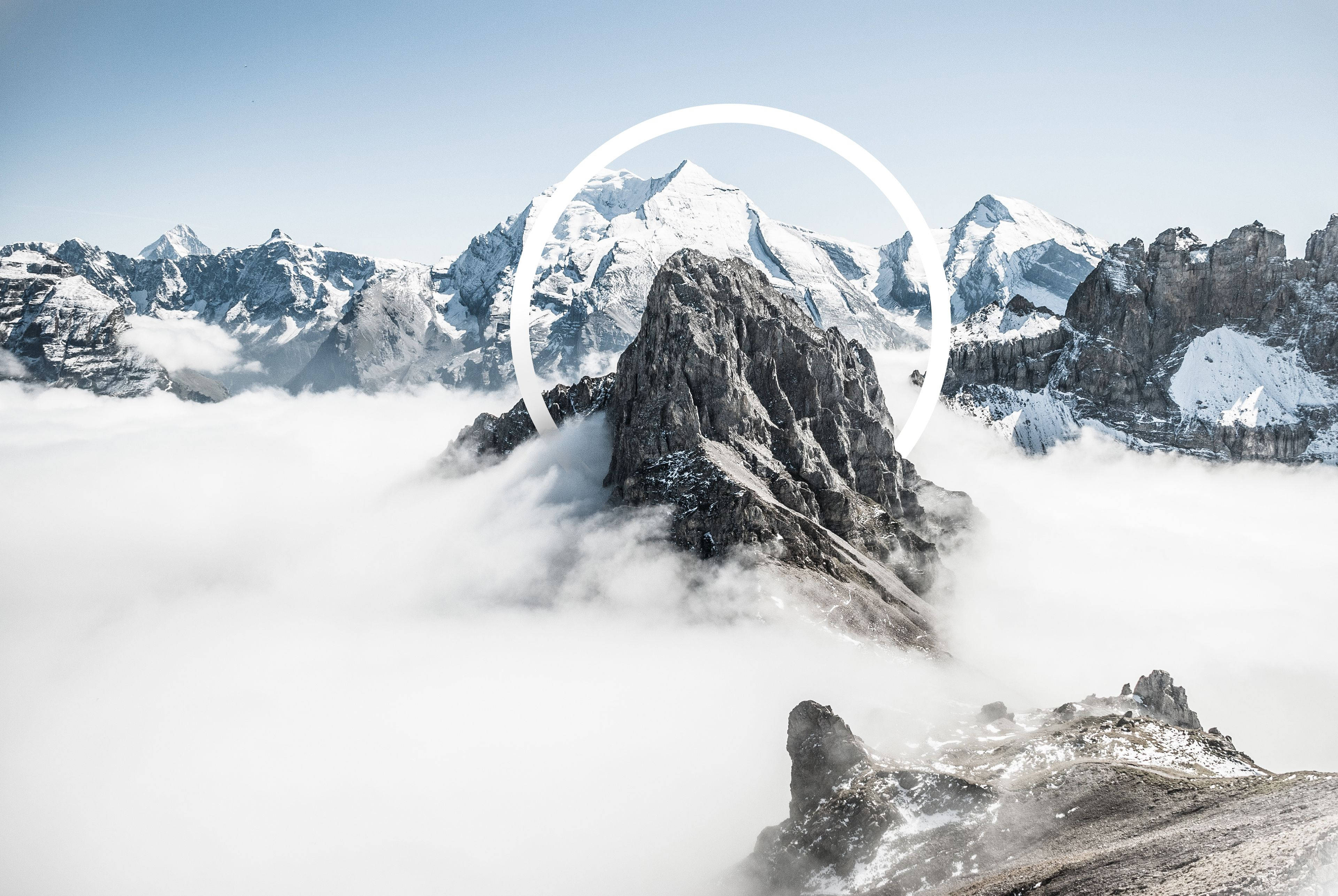 snowcapped mountain peak, sea of clouds, white circular graphic, 4K Desktop Wallpaper