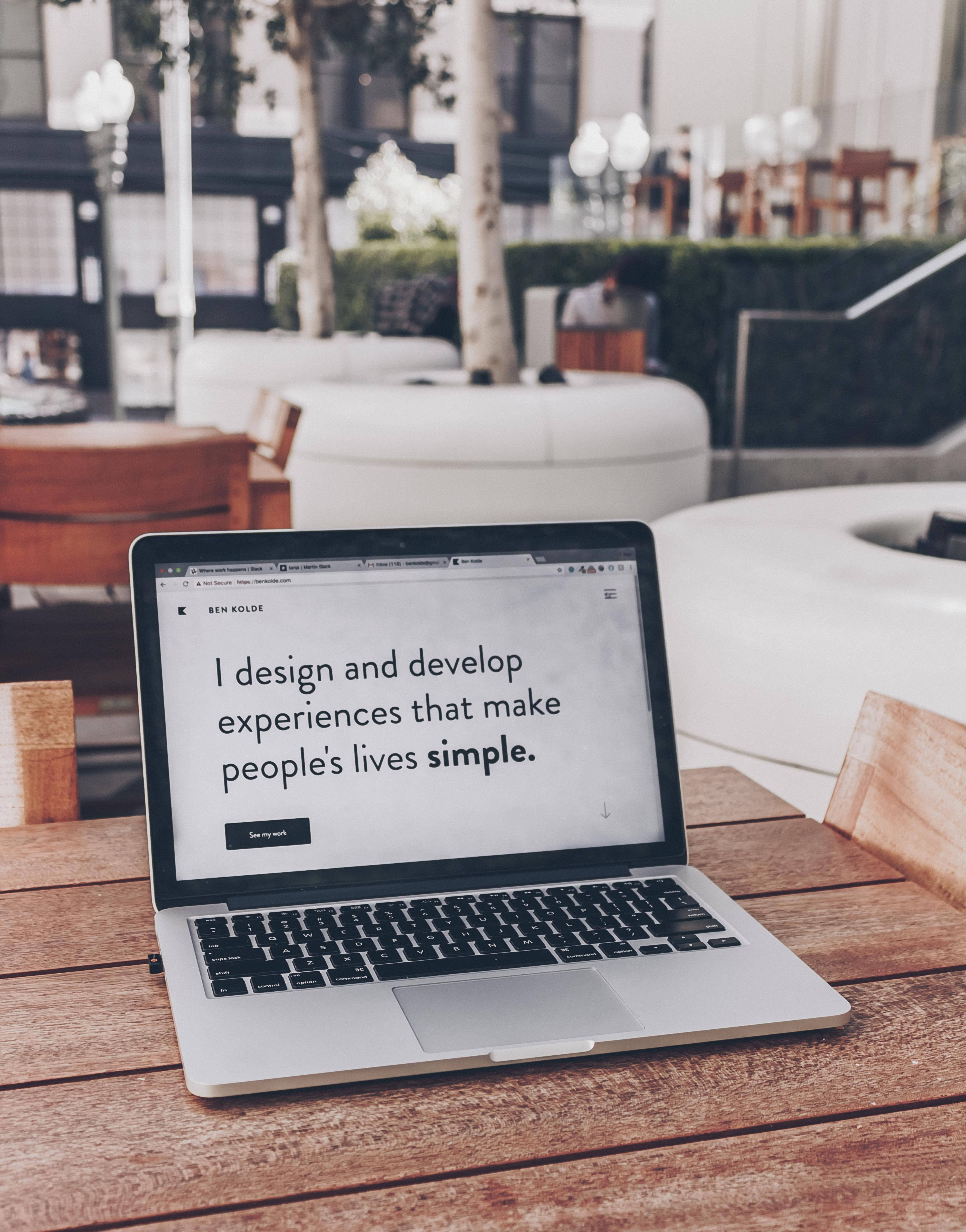 silver laptop, wooden table, minimalist personal website, 4K Phone Wallpaper