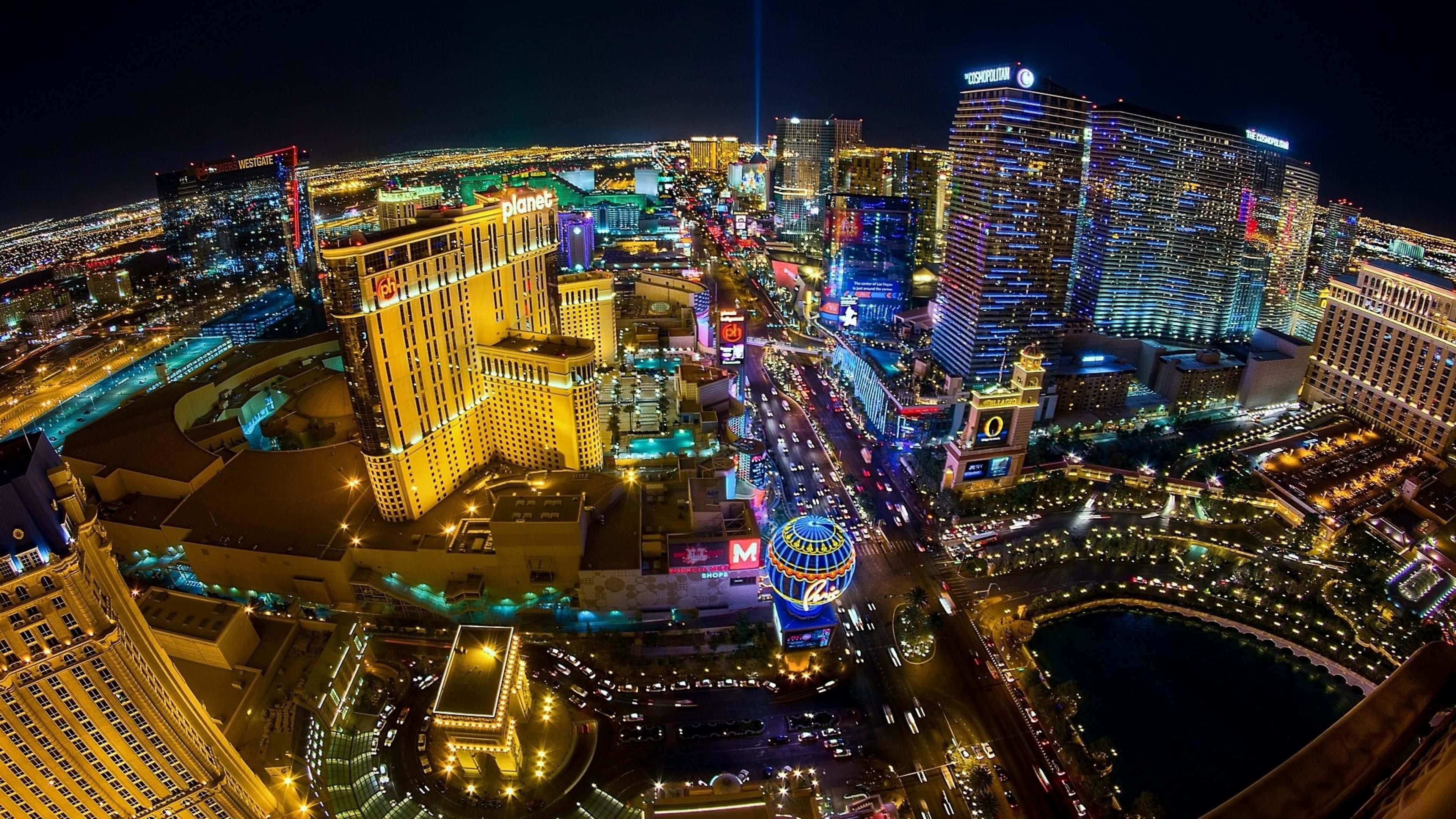 Las Vegas Skyline, nighttime aerial view, neon-lit skyscrapers, 4K Desktop Wallpaper