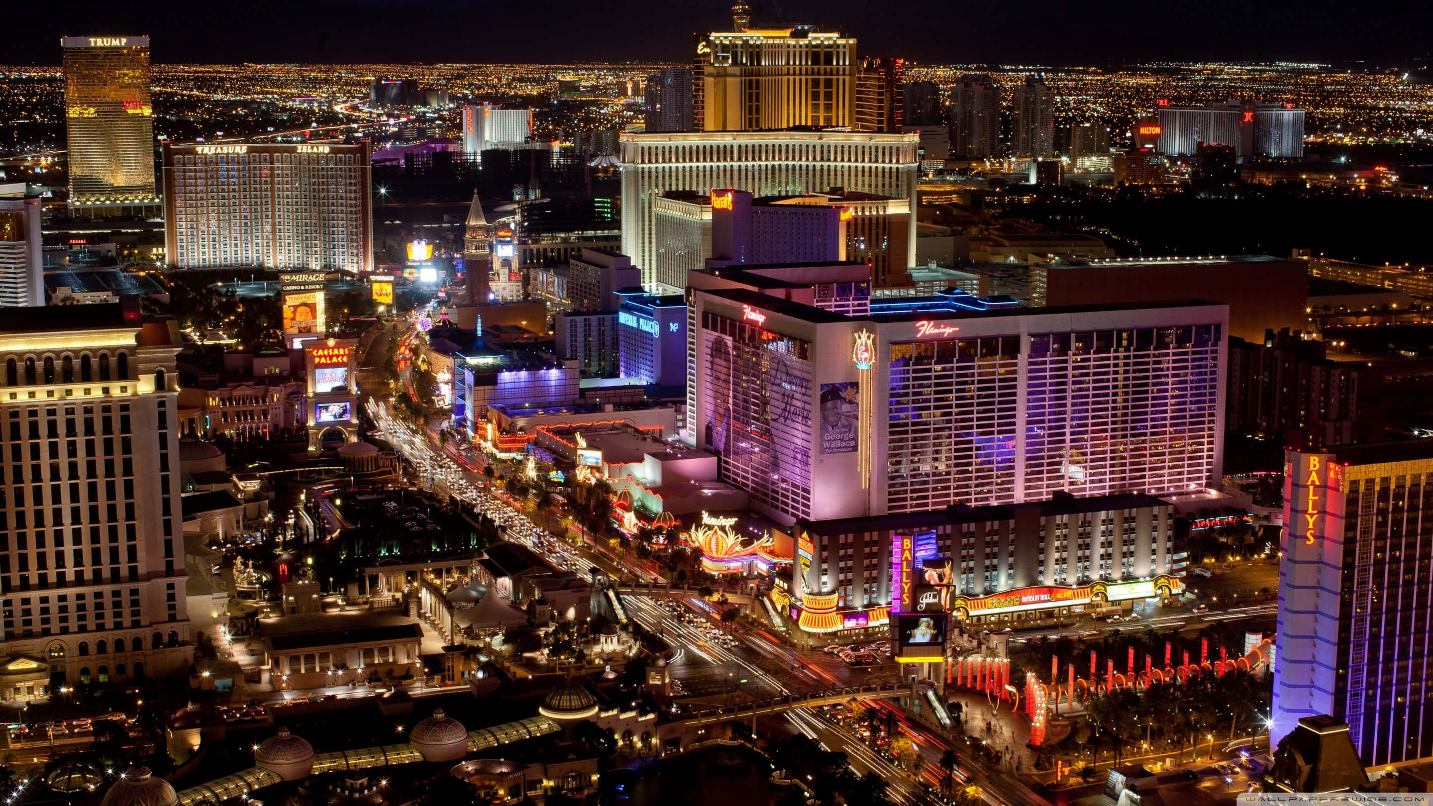 Las Vegas Skyline, neon-lit hotels, bustling streets, 2K Desktop Wallpaper