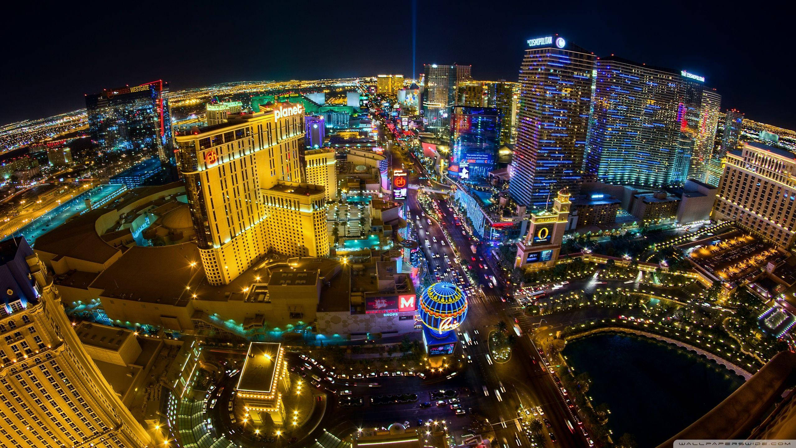 Las Vegas Strip, neon lights, bustling traffic, 2K Desktop Wallpaper