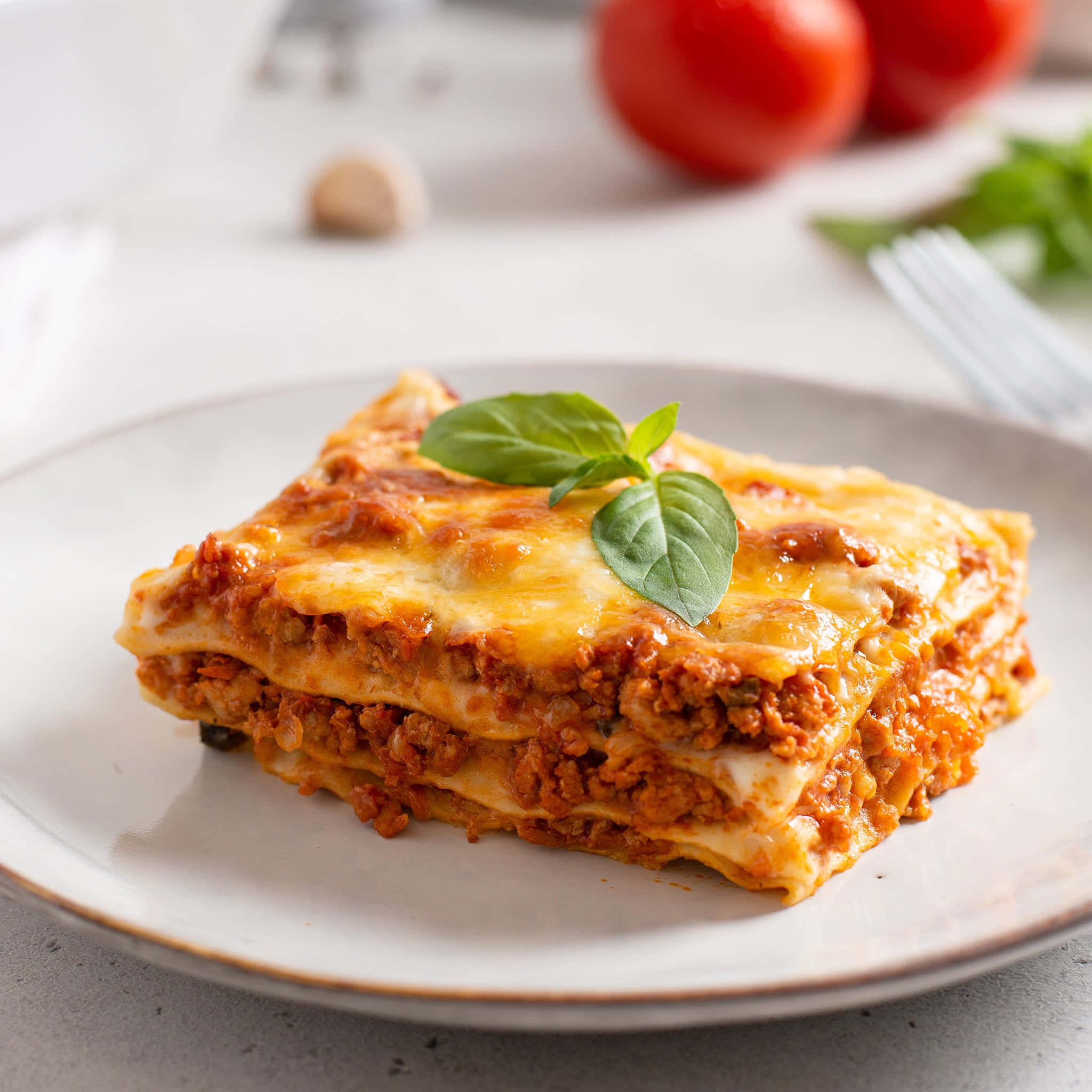 lasagna alla bolognese, melted cheese, basil garnish, Full HD Desktop Wallpaper