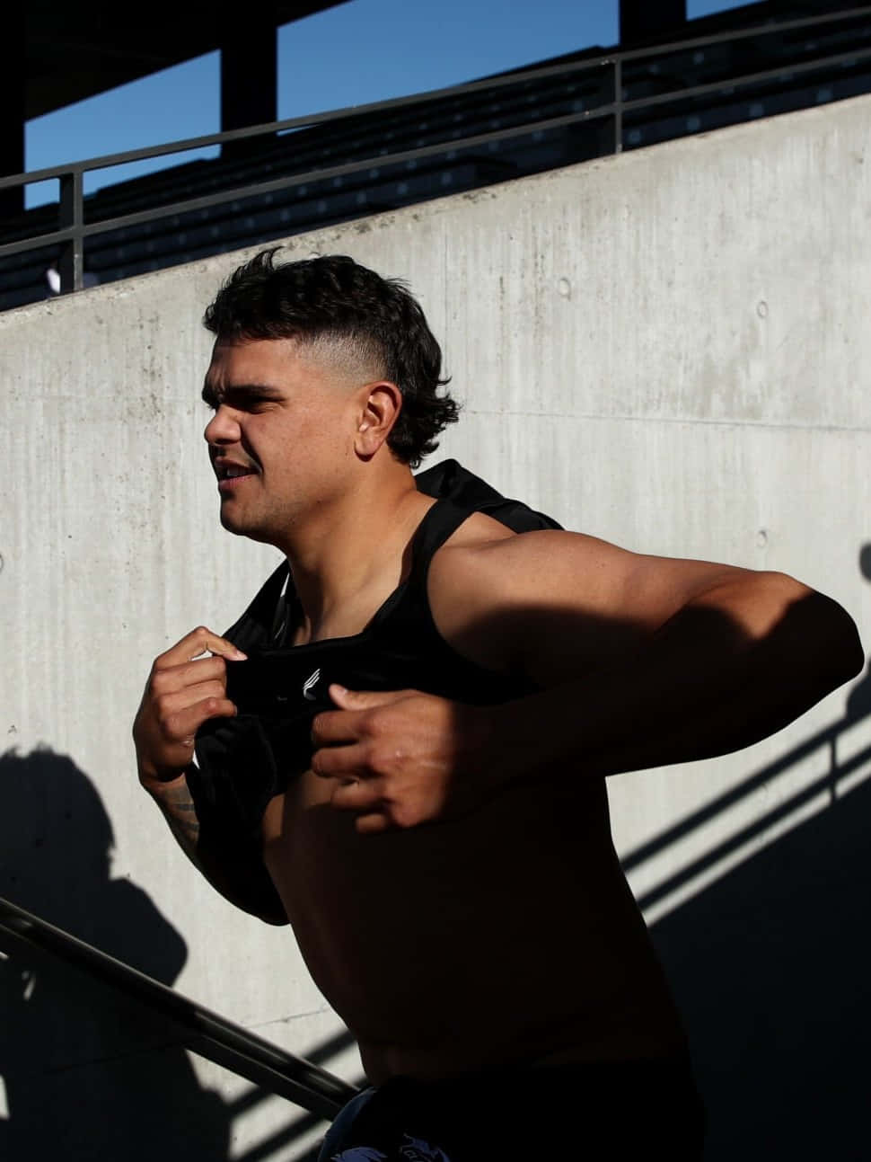 Latrell Mitchell, black tank top, sunlit concrete wall, HD Phone Wallpaper