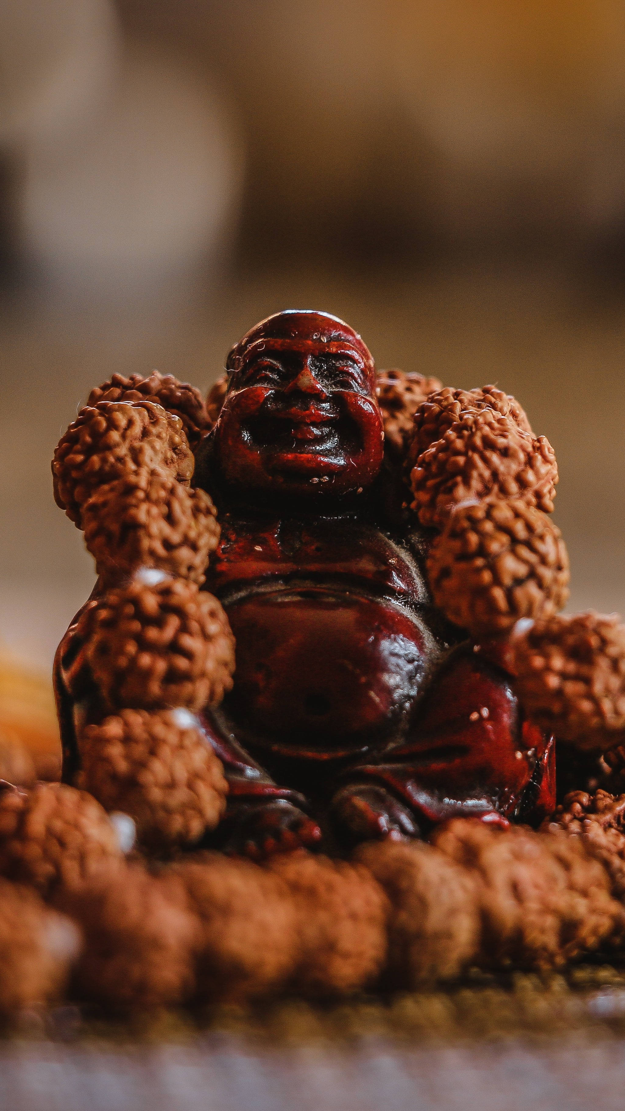 brown laughing buddha statue, glossy wooden, textured prayer beads, 2K Phone Wallpaper