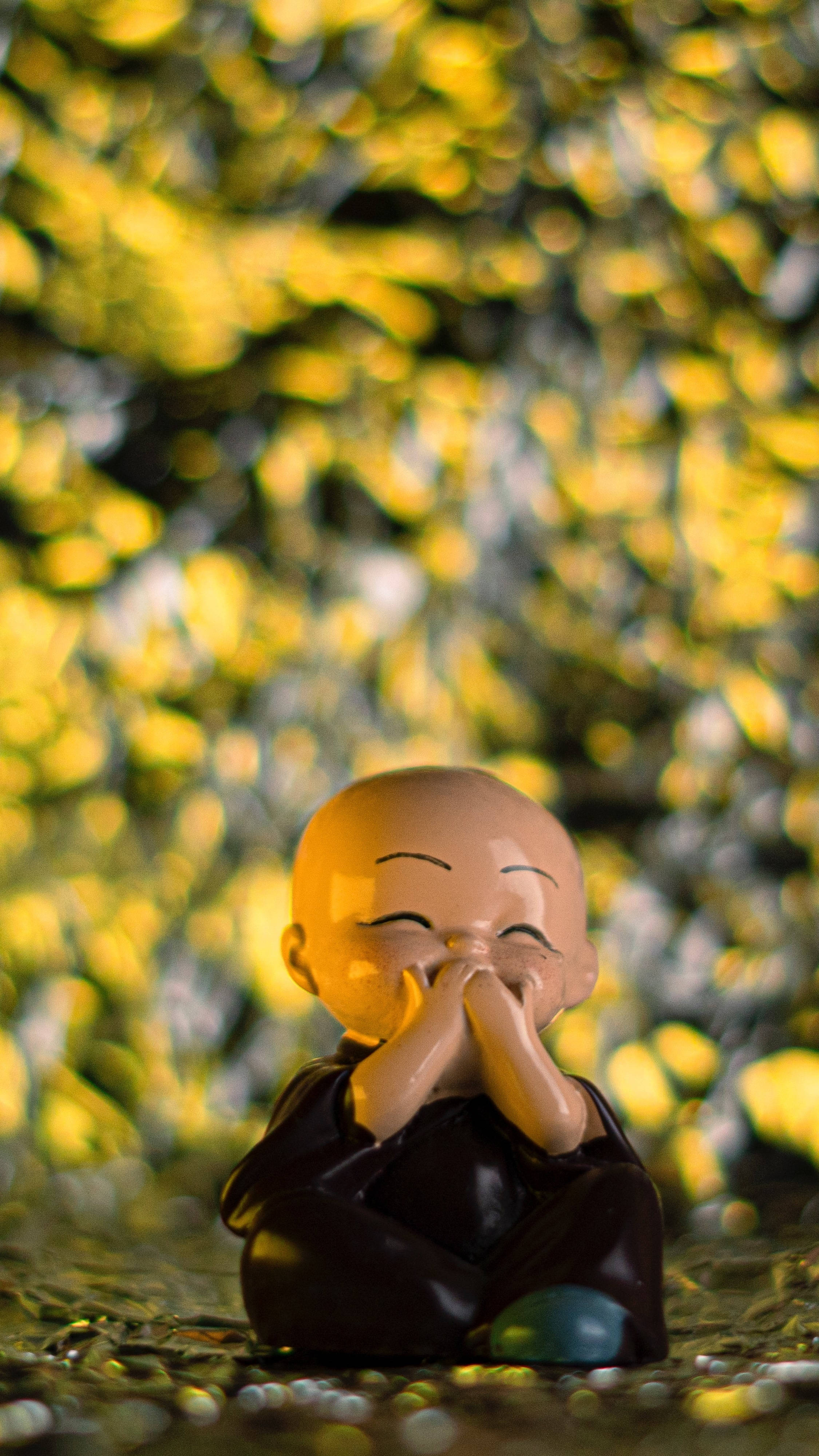 Laughing Buddha, golden bokeh background, pebbles, 4K Phone Wallpaper
