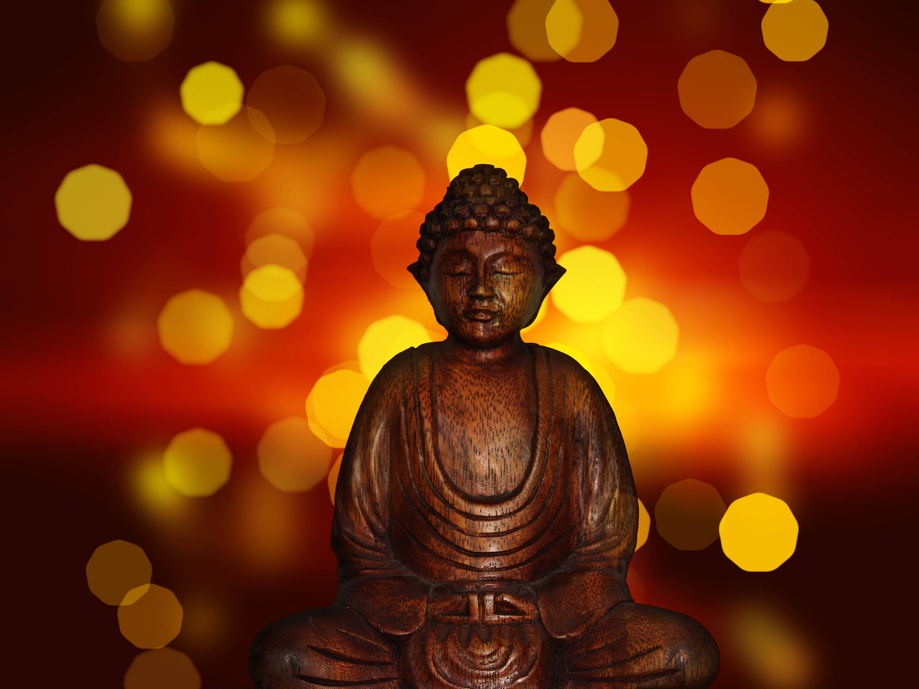 Buddha, wooden Buddha statue, glowing amber, 2K Desktop Wallpaper