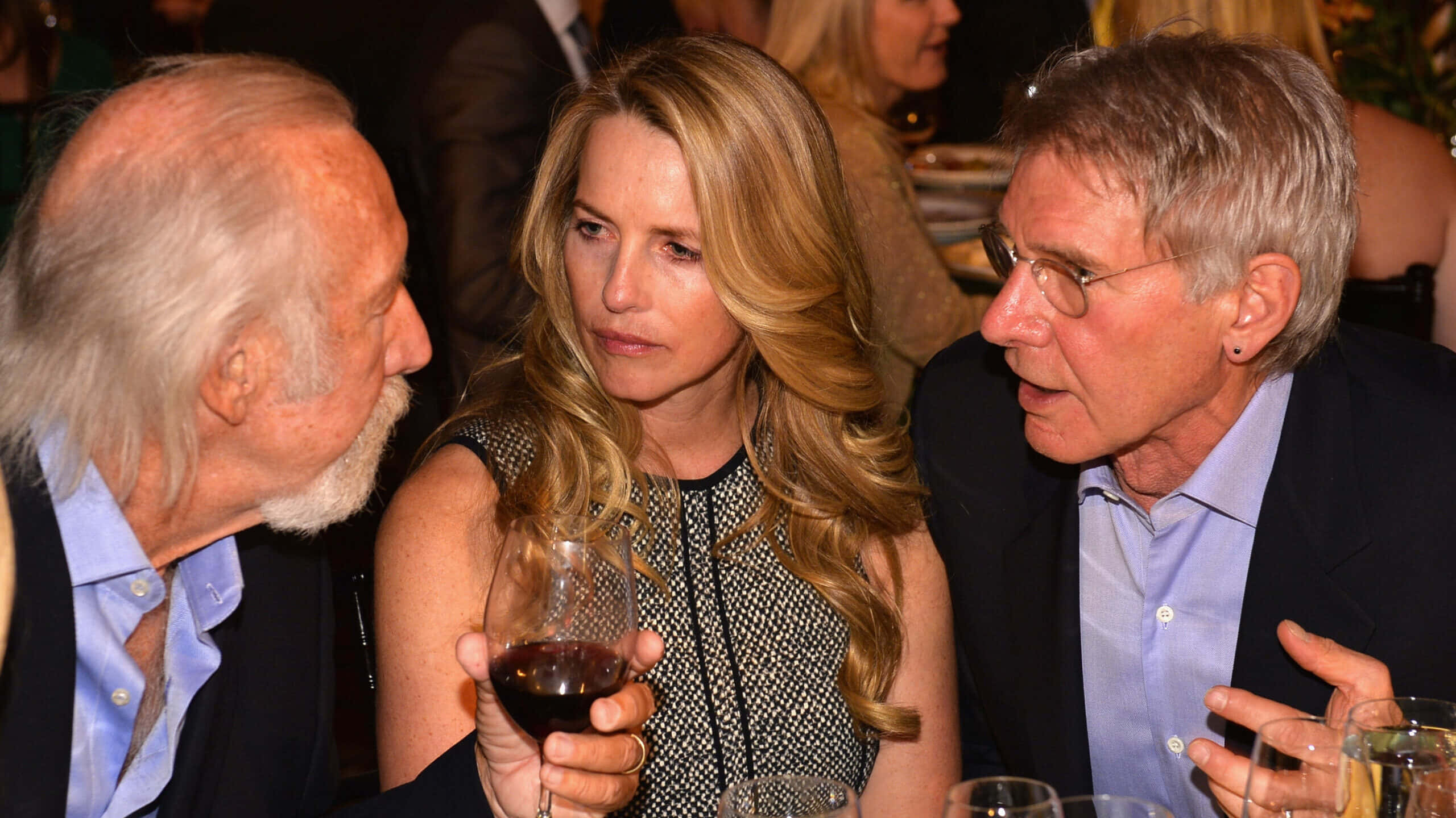Laurene Powell Jobs, dinner party, dimly lit, 2K Desktop Wallpaper