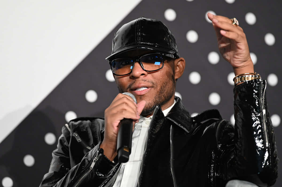 Law Roach, black shiny cap, black and white polka dot backdrop, SD Desktop Wallpaper